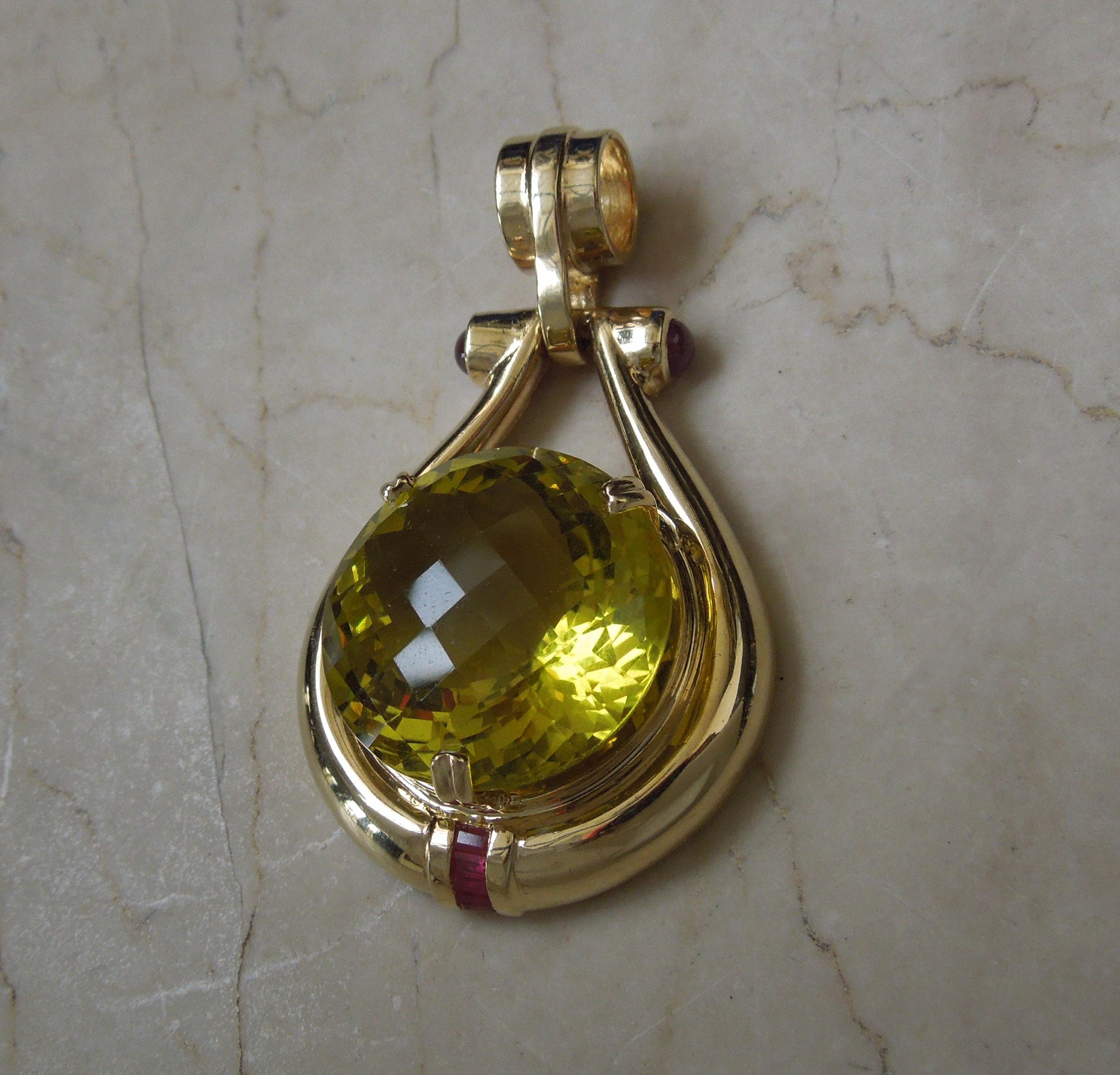 Constructed completely of 14KT Yellow Gold
in a Retro Inspired design

with 1 Focal G.I.A. Certified Faceted Natural Lemon Citrine / Lemon Quartz
weighing approximately 40.00 carats
Secured in 3 Doubled Prongs

Accented with 2 Bezel set Round