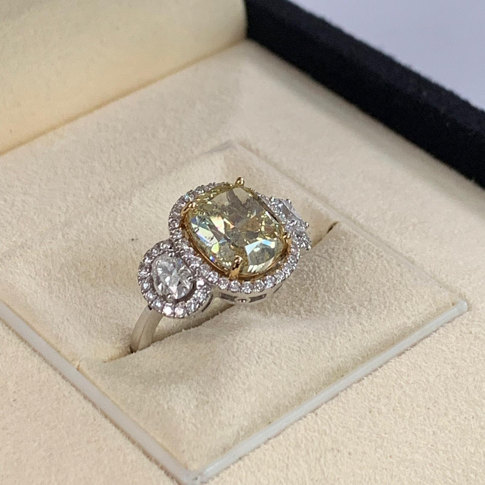 GIA 4.01 Carat Fancy Yellow Cushion Cut Diamond Ring 18 Karat white gold In New Condition In Great Neck, NY