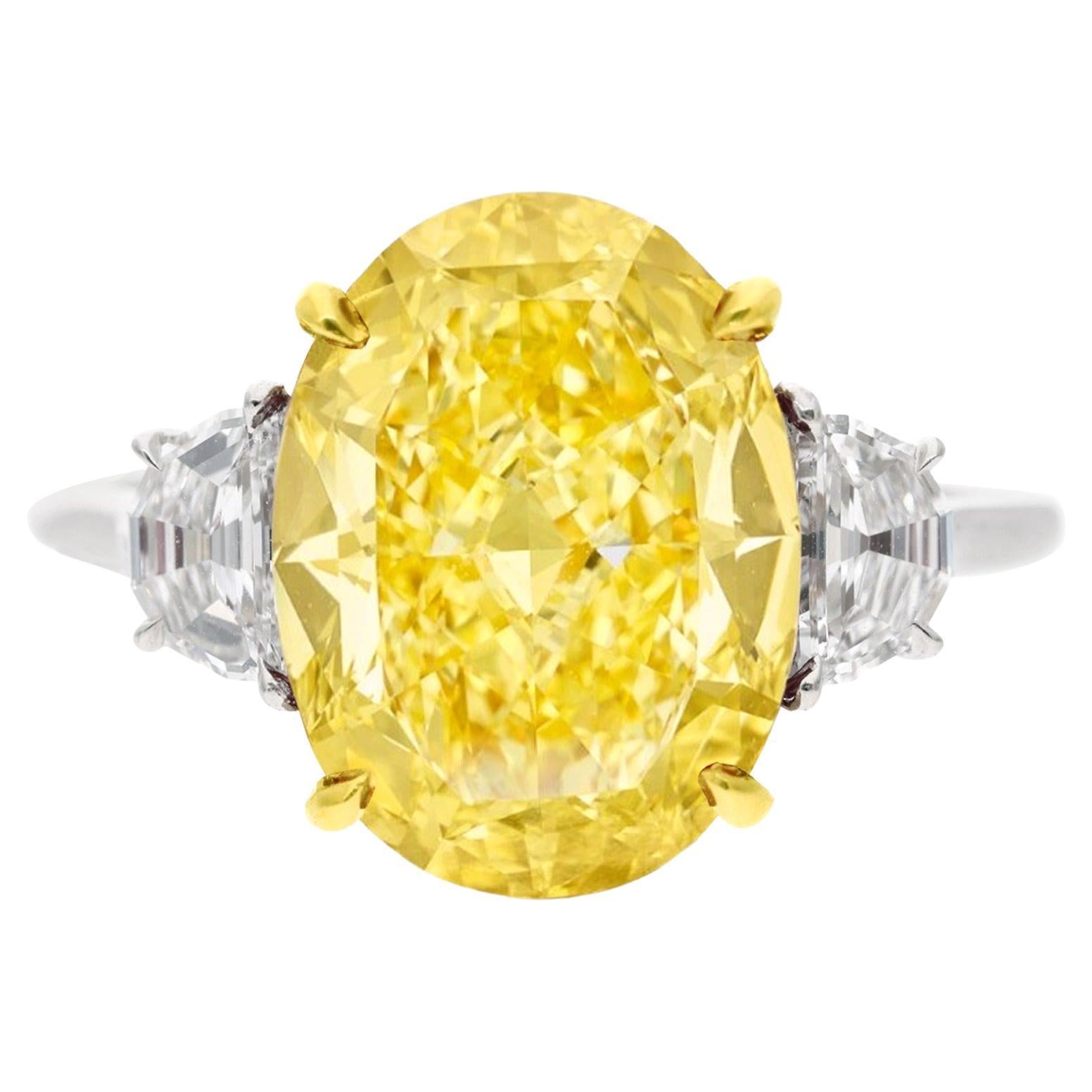 GIA Certified 4.01 Carat Fancy Yellow VS1 Oval Diamond Three Stone Ring