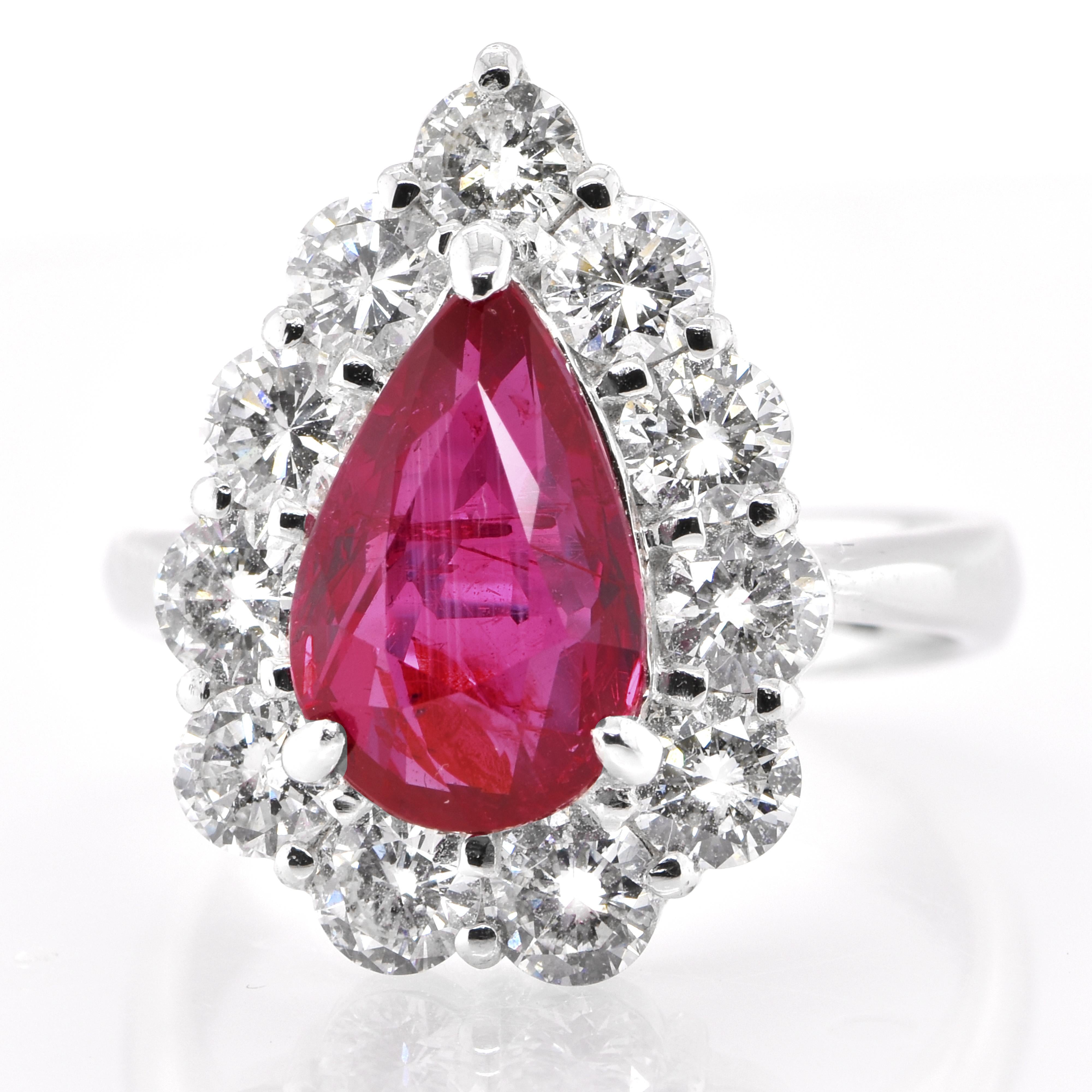 A beautiful ring set in Platinum featuring a GIA Certified 4.01 Carat Natural Mozambique No Heat Ruby and 2.05 Carat Diamonds. Rubies are referred to as 