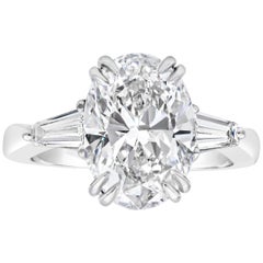 GIA Certified 4.01 Carat Oval Cut Diamond Three-Stone Engagement Ring