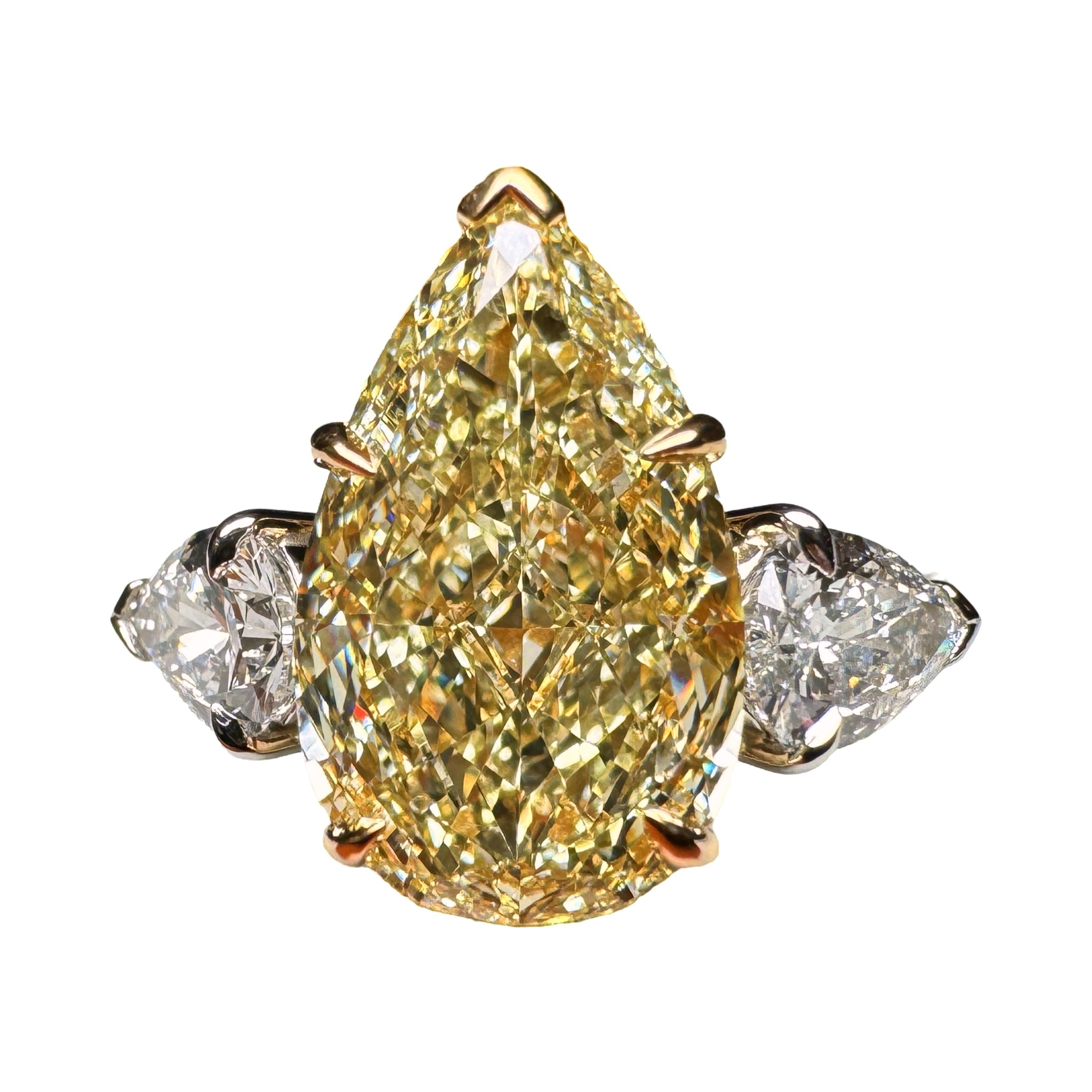 GIA Certified 4.01 Carat Pear Cut Yellow Diamond 3 Stone Ring For Sale 1