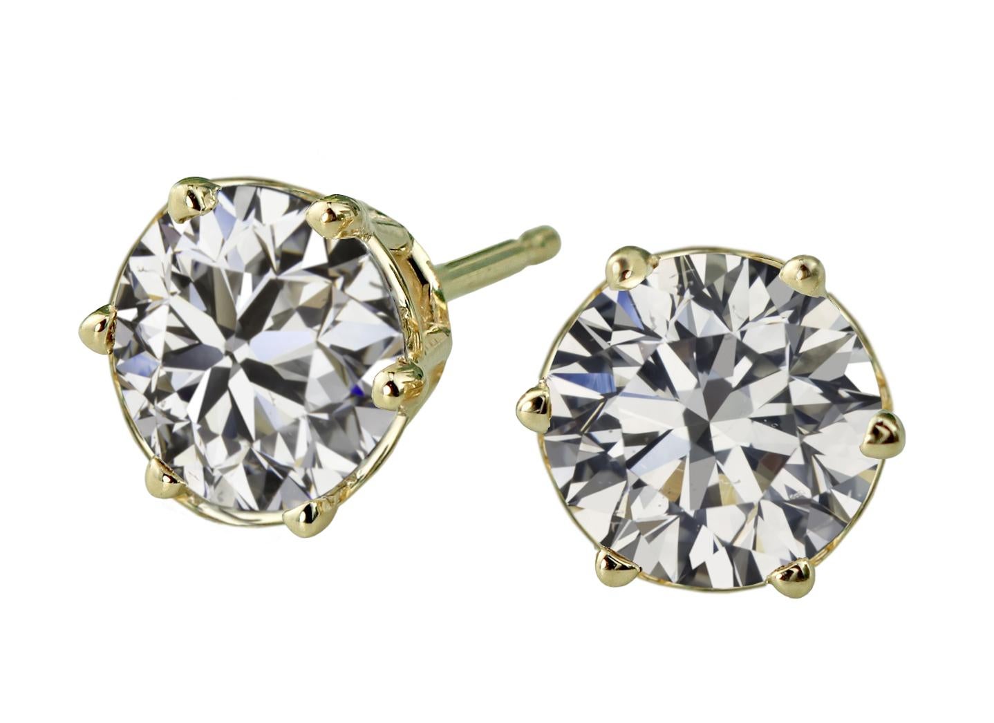 An exquisite pair of 18 carat yellow gold diamond studs
the mounting is customizable