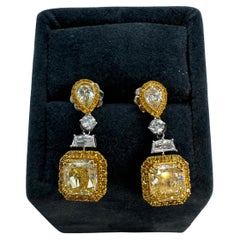 GIA Certified 4.01 Carats Fancy Yellow Diamond Earrings in 18k White Gold