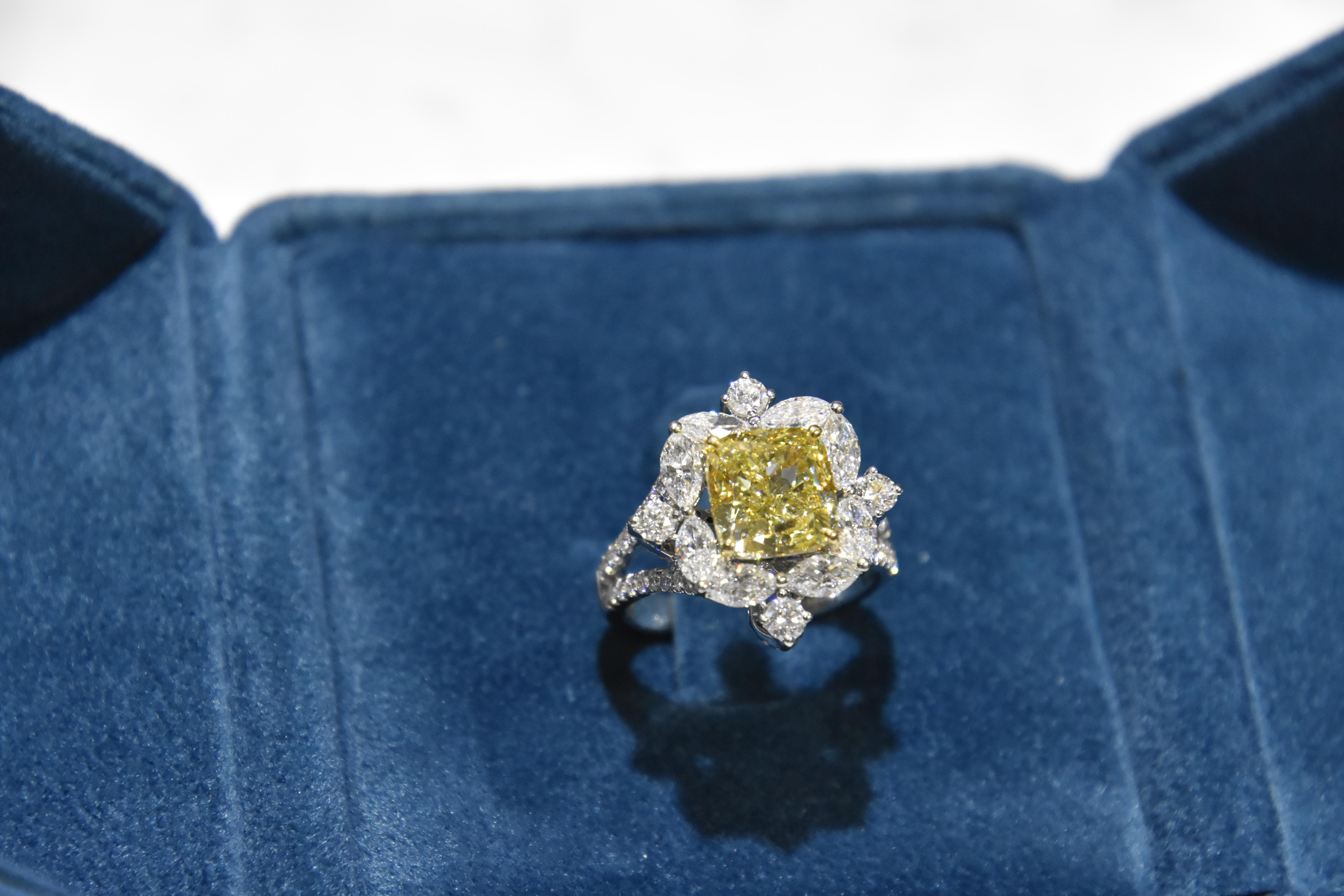 Contemporary classic designed ring featuring a 4.01 carat cushion cut Fancy greenish yellow diamond ring with D-F vvs- vs quality white diamond finished in white gold. 

Center stone certified by world wide known GIA institution. (6175835324)
Ring