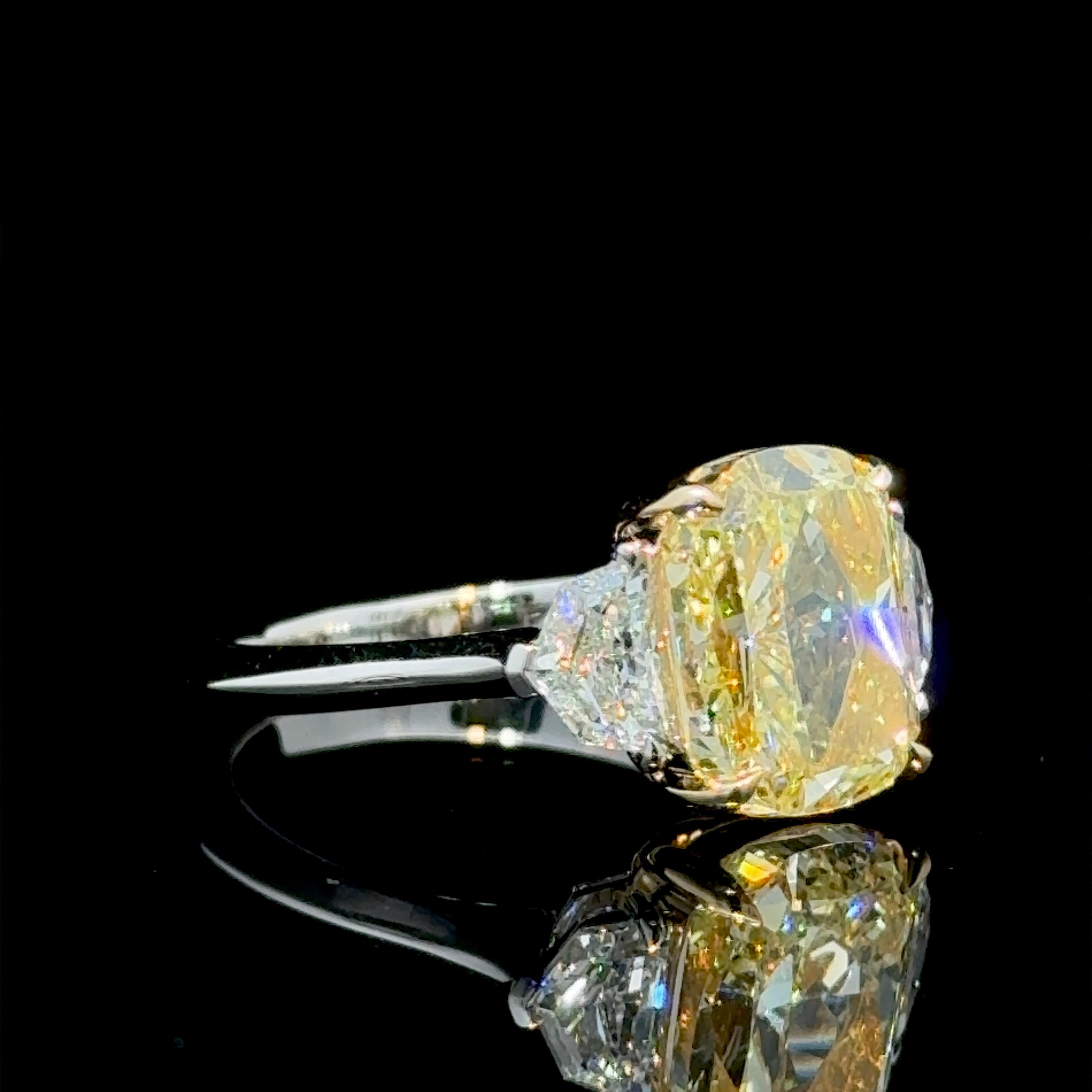 GIA Certified 4.02 Carat Cushion Cut Fancy Yellow Diamond Three Stone Ring In New Condition For Sale In New York, NY