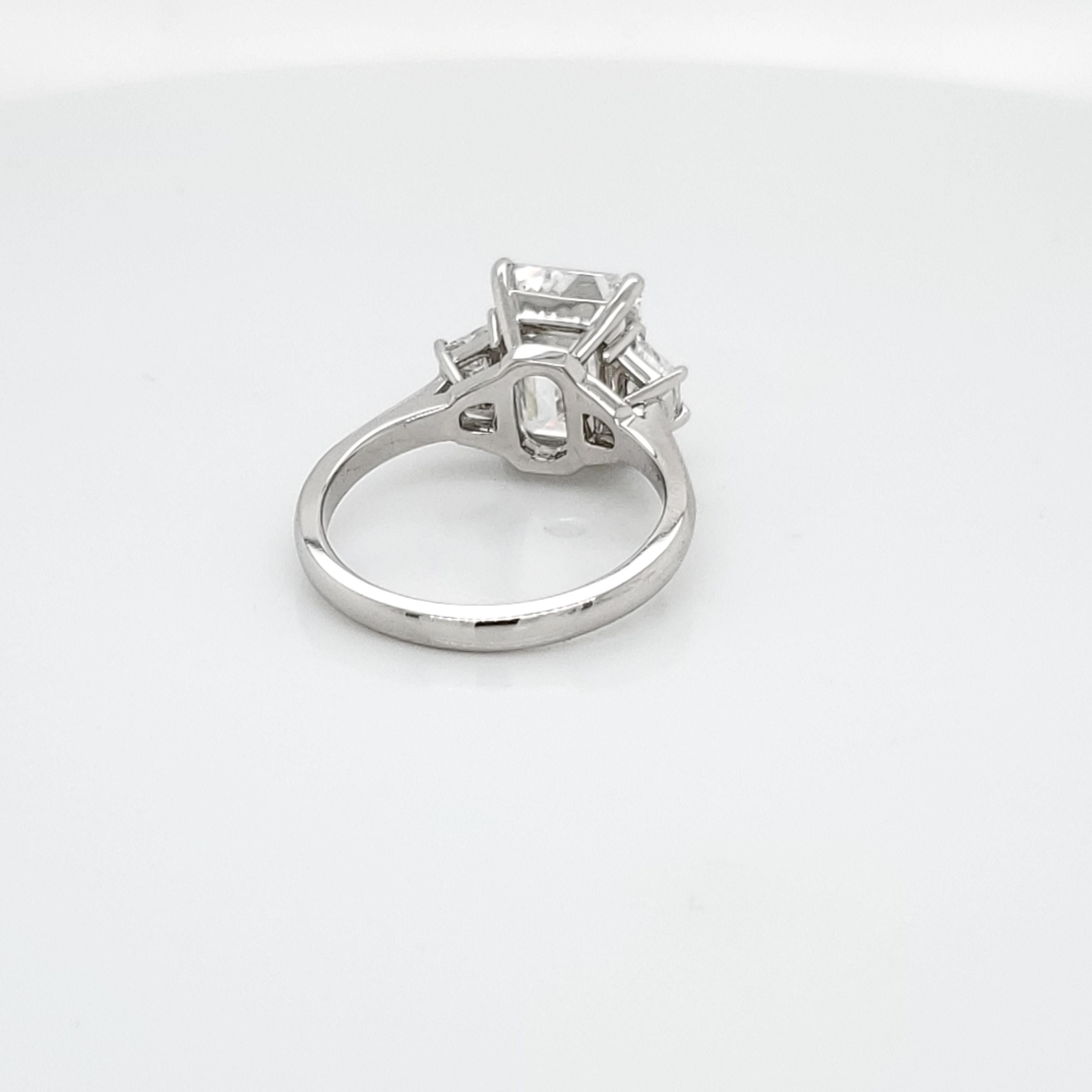 Women's GIA Certified 4.02 Carat Emerald Cut Three-Stone Ring