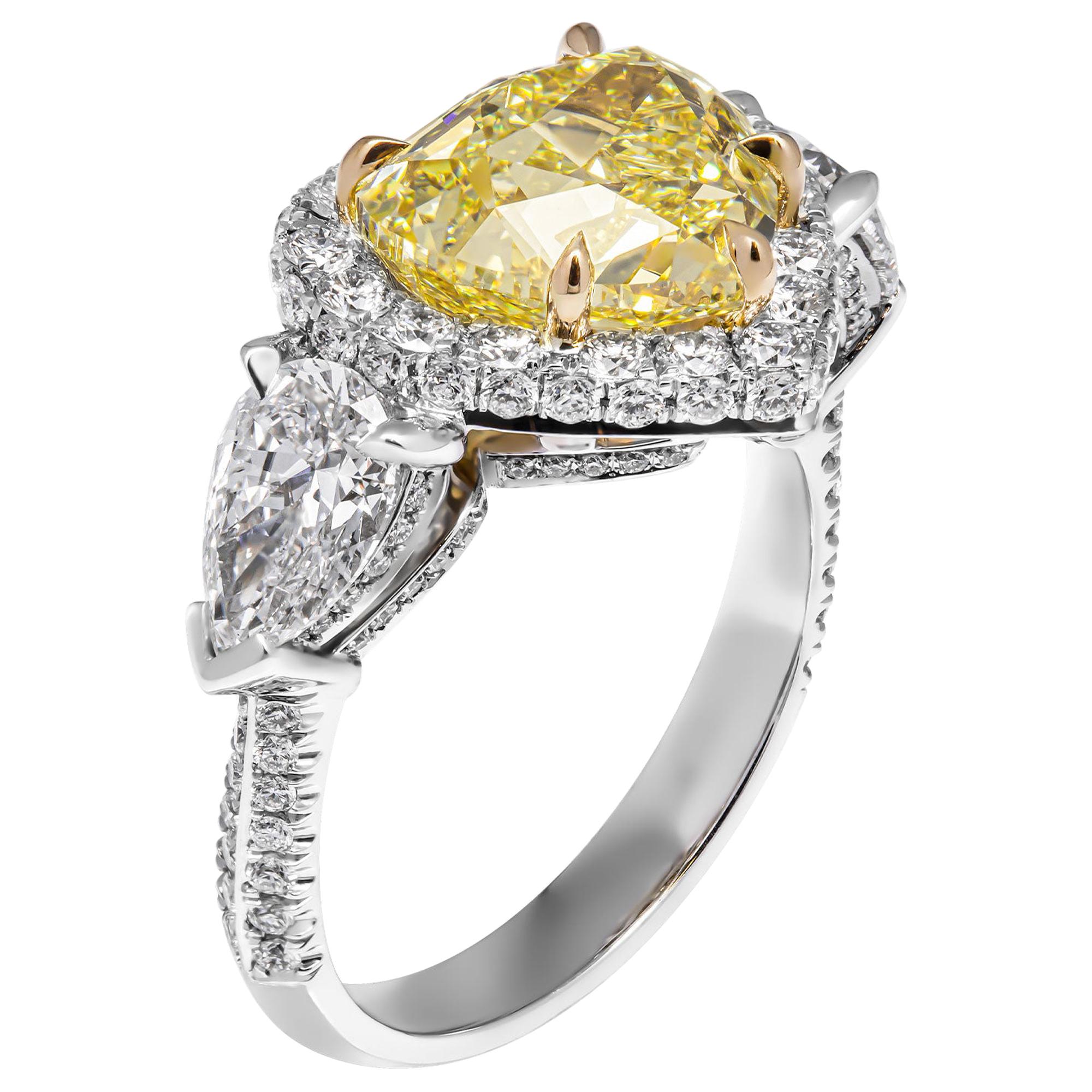 GIA Certified 4.02 Carat Fancy Yellow Heart Shape Three-Stone Ring