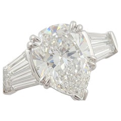 GIA Certified 4.02 Carat Pear Brilliant Diamond Three-Stone Ring