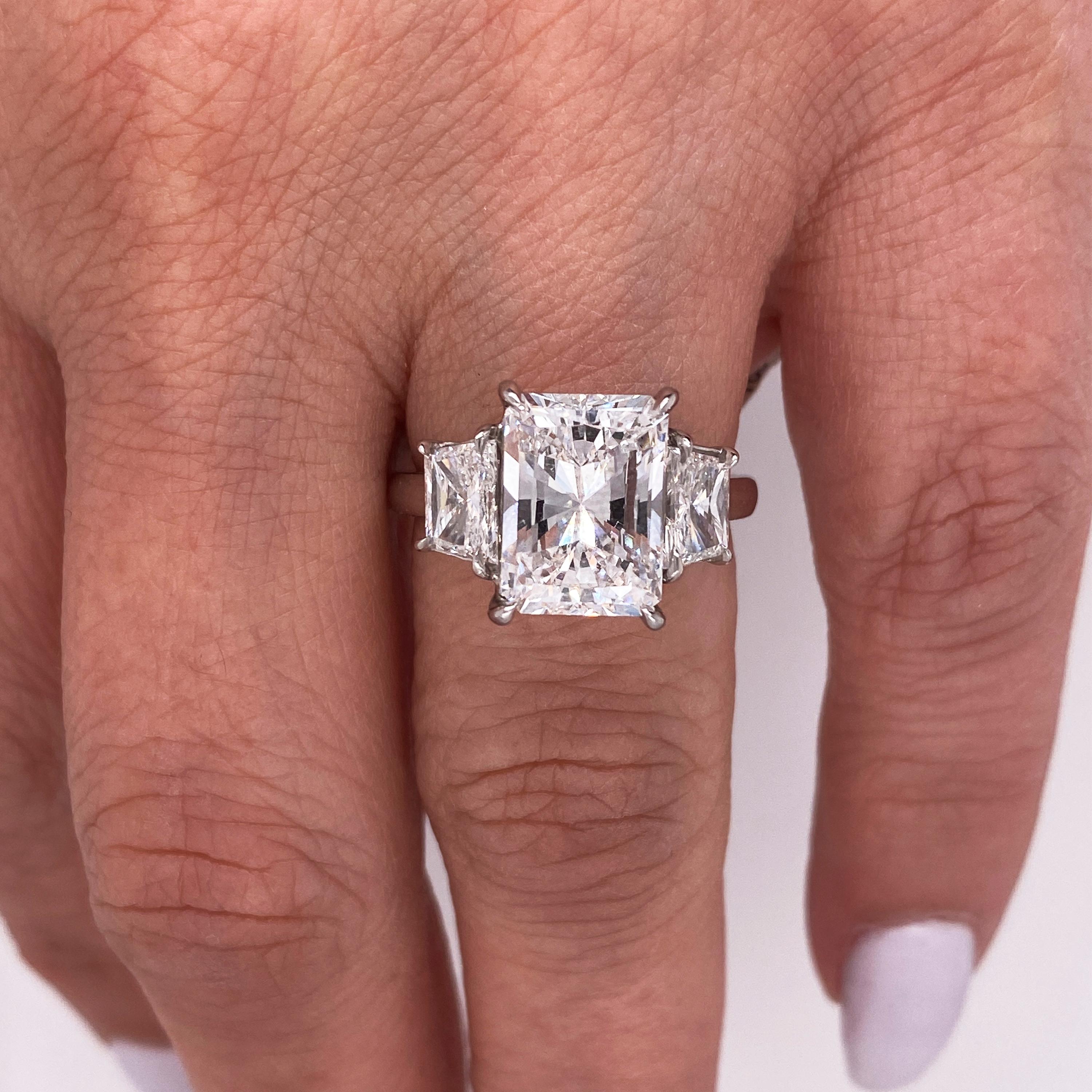 GIA Certified 4.02 Carat Radiant Cut Diamond Platinum Trapezoid Diamond Ring

This illustrious, fiery 4.02 carat Radiant cut diamond with such high color is a masterpiece from mother nature. 

Radiant cut diamond is 4.02 carat, E color, SI1 clarity