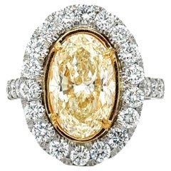 Oval Yellow Diamond Ring 4.02 Carats GIA. With 2.01 carats MicroPave. Plat/18KYG