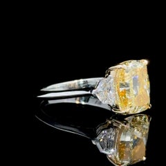 GIA Certified 4.02 Cushion Cut Yellow Diamond Three Stone Ring