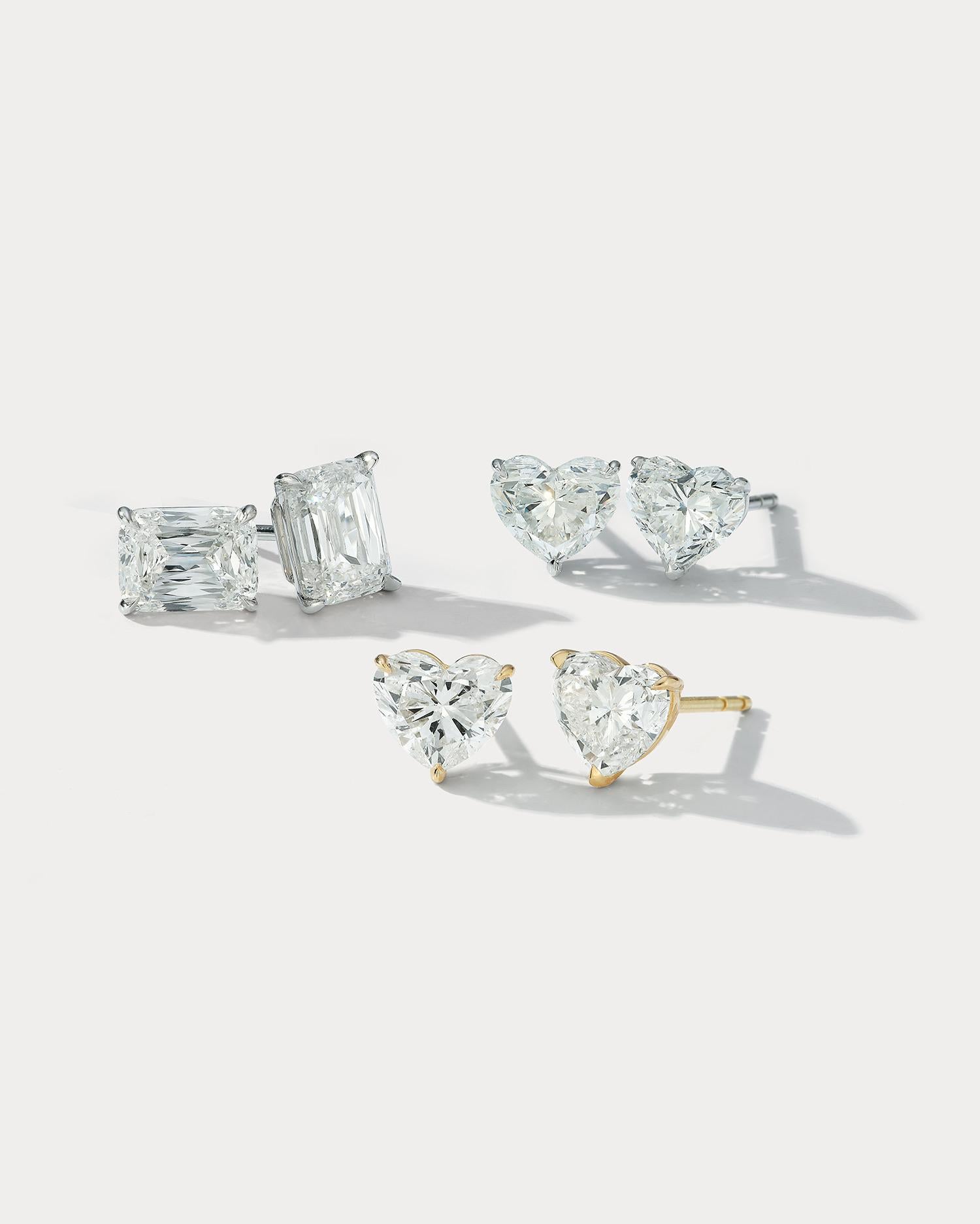 These are 4.02 total weight Heart Shape Stud Earrings set in Platinum.  A perfect choice for those seeking a timeless and sentimental piece of jewelry. The platinum setting provides a luxurious and durable setting for the stones, ensuring they will