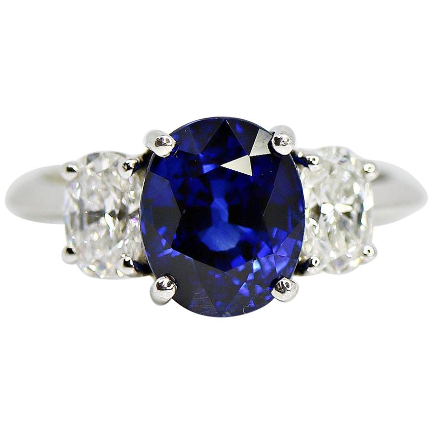 GIA Certified 4.03 Carat Oval Cut Blue Sapphire and Diamond Ring