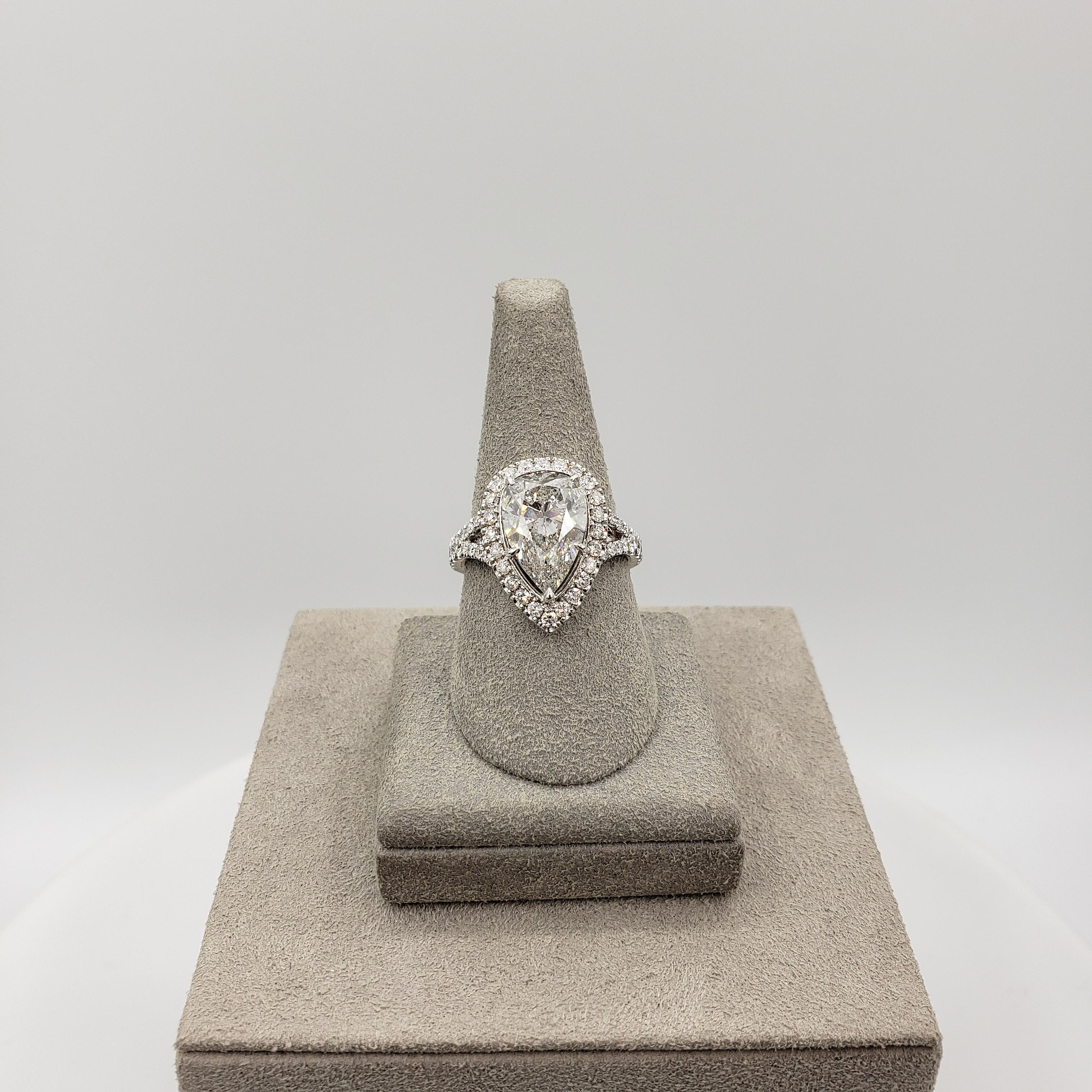 Contemporary GIA Certified 4.03 Carats Pear Shape Diamond Halo Engagement Ring in White Gold For Sale