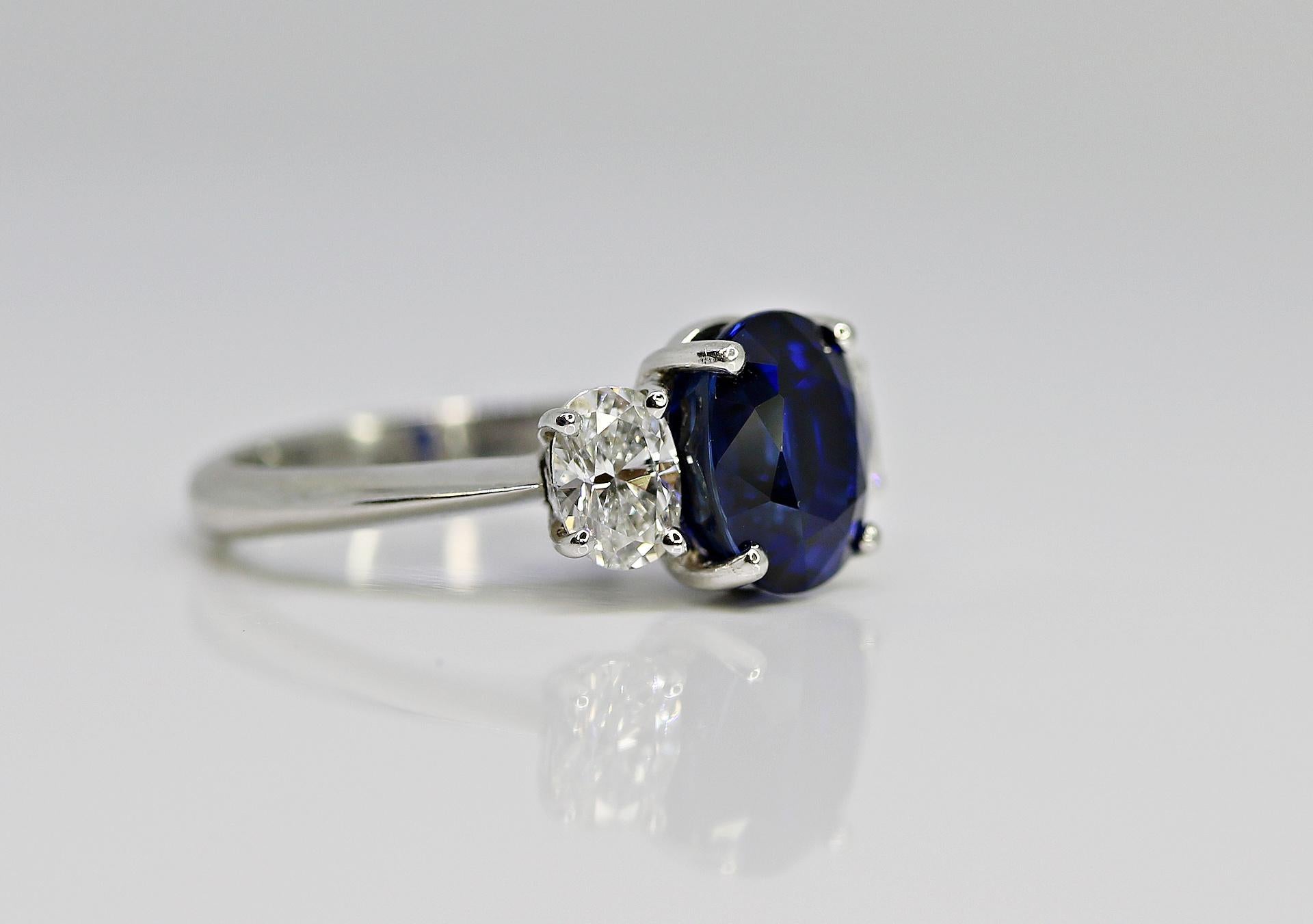 This 4.03ct Blue sapphire Oval is set in a Platinum ring with 2 side oval diamonds totaling in weight =0.70ct

This Sapphire is GIA certified #5182780792