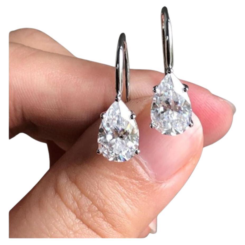 GIA Certified 4.04 Carat Pear Shape, D color, I1 clarity Dangle Earring For Sale