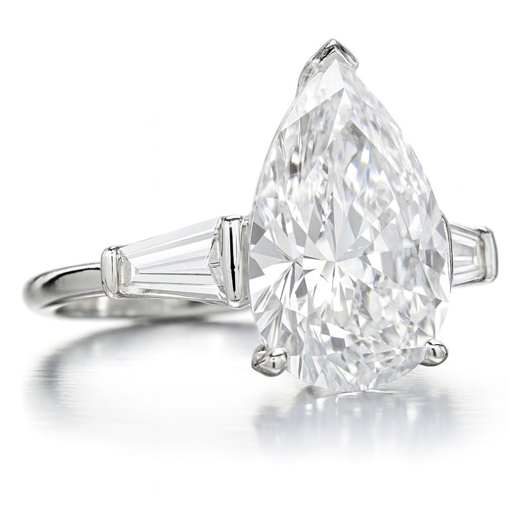 GIA Certified 4.05 Carat E Color Flawless Pear Cut Diamond Ring

A breathtaking masterpiece showcasing a GIA Certified 4.05 Carat Pear Brilliant Diamond, graded E Color and Flawless Clarity, with Excellent polish and symmetry. Measuring 14.21 x 9.01