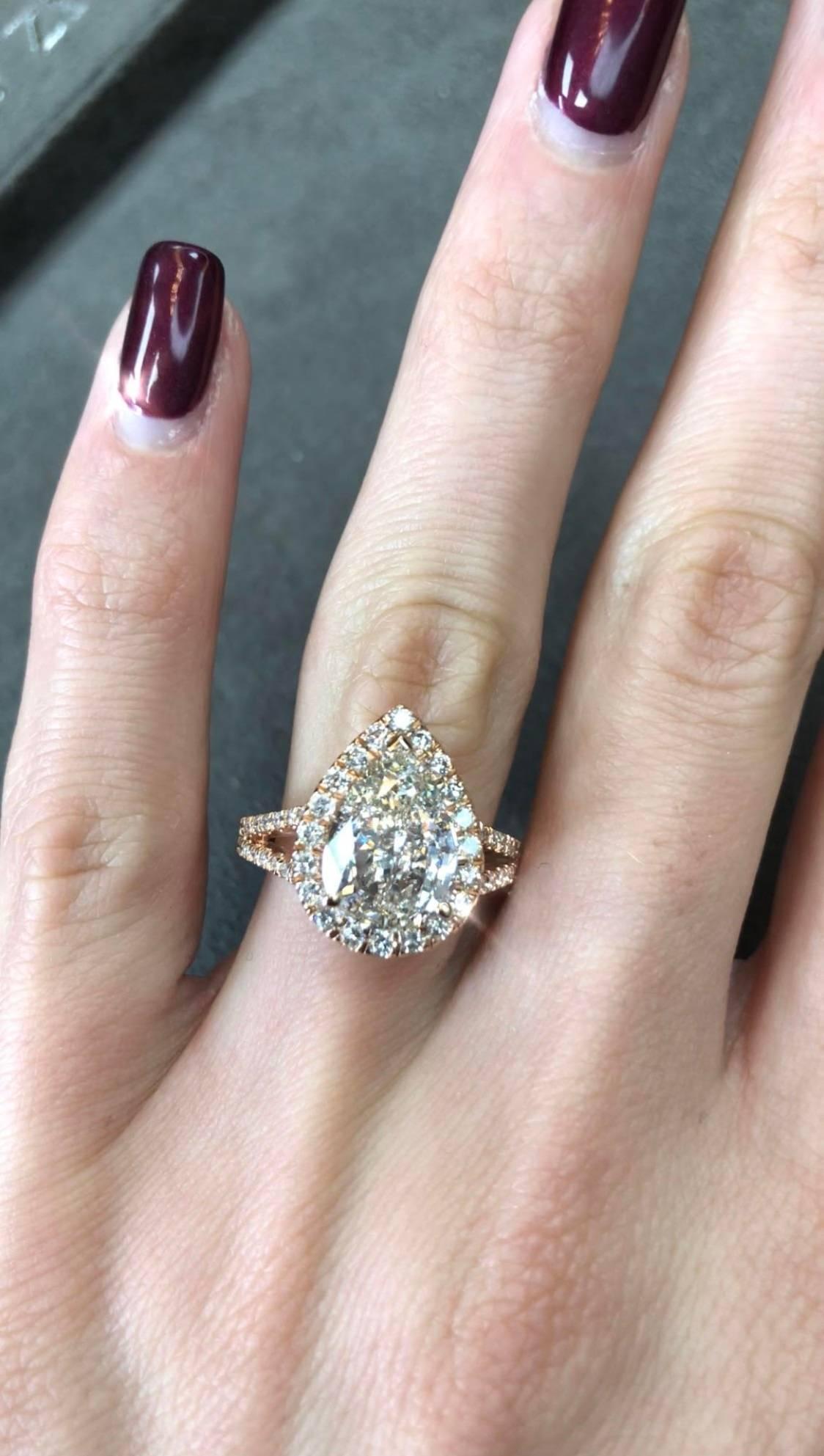 This unique one of a kind pear shaped diamond ring will take your breath away! This mesmerizing 14k rose gold ring features a 3.01ct pear shaped diamond in the center. It is GIA certified at J-VS2, near colorless and perfectly clear, even under 10X