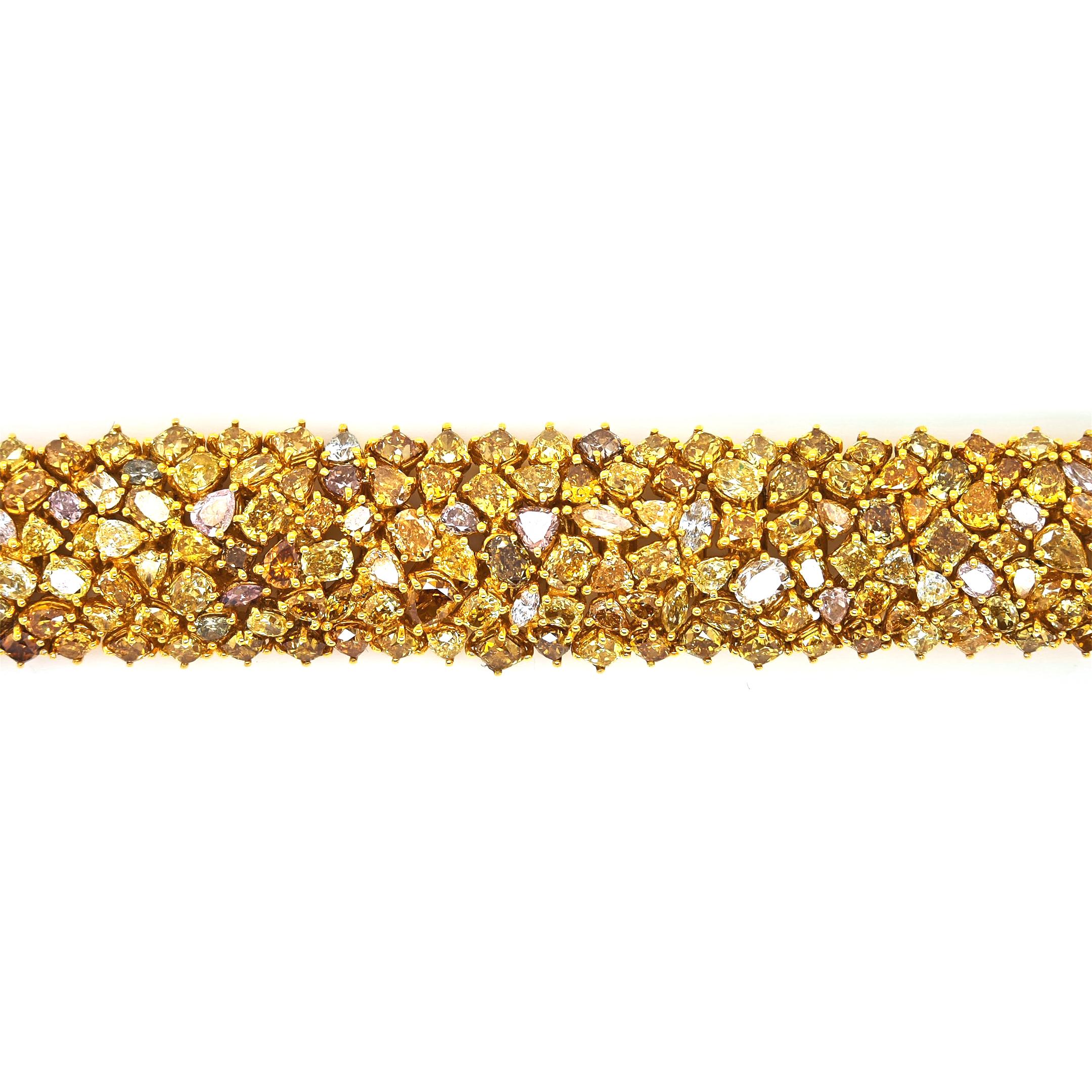 326 Fancy Diamonds: 40.74 Carats
Metal: 18K White Gold, 57.60 Grams
GIA Certificate # 5131076678
