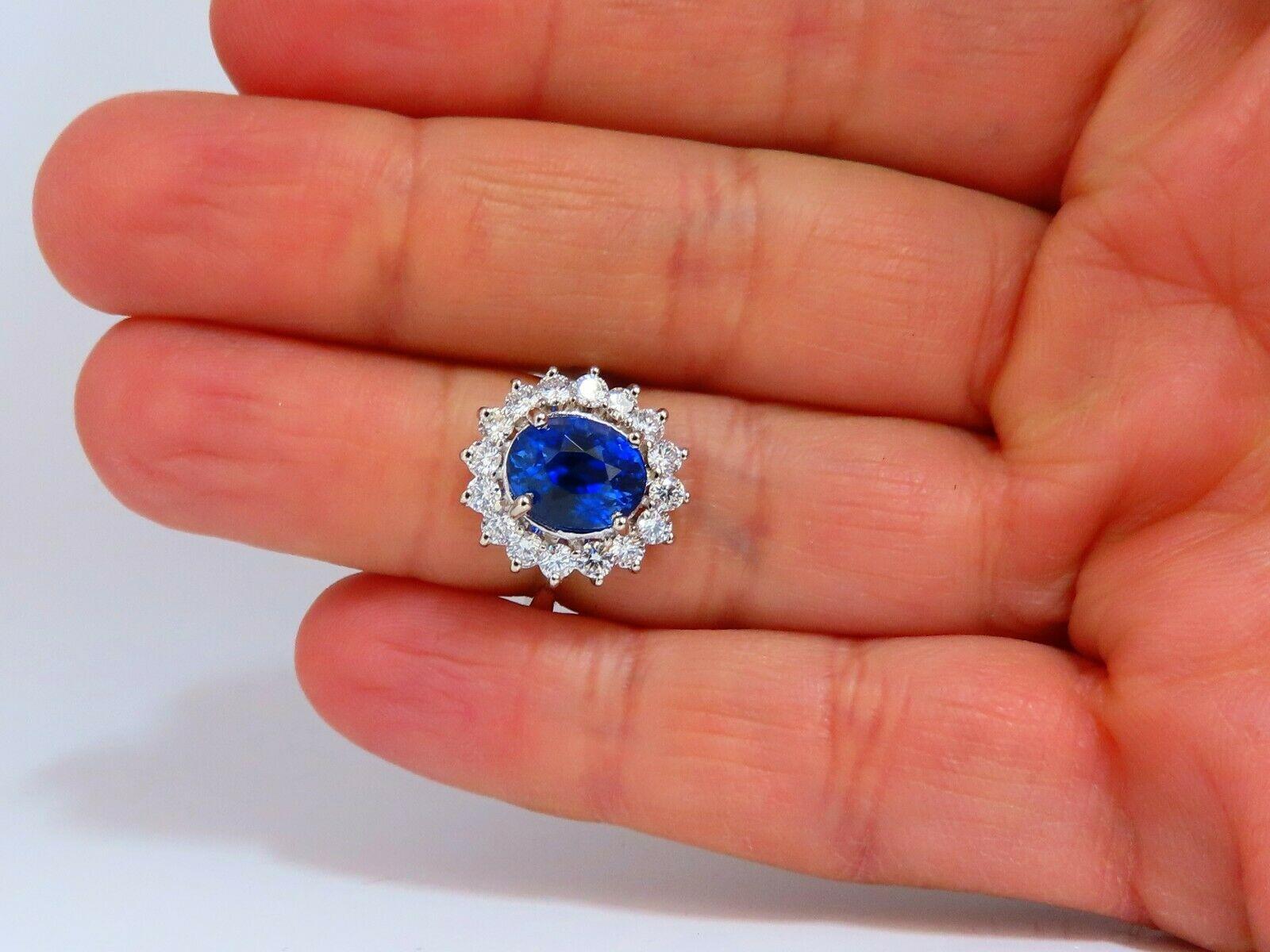 Classic Halo Cluster

GIA Certified 

4.05ct. Natural Madagascar Blue Sapphire ring.

Report:  5211431444

Oval cut: 9.91 x 7.70 x 6.49mm

Clean Clarity, Transparent

Even Blue



.86ct. Side natural Round diamonds

G color, Vs-2 clarity.

14kt.