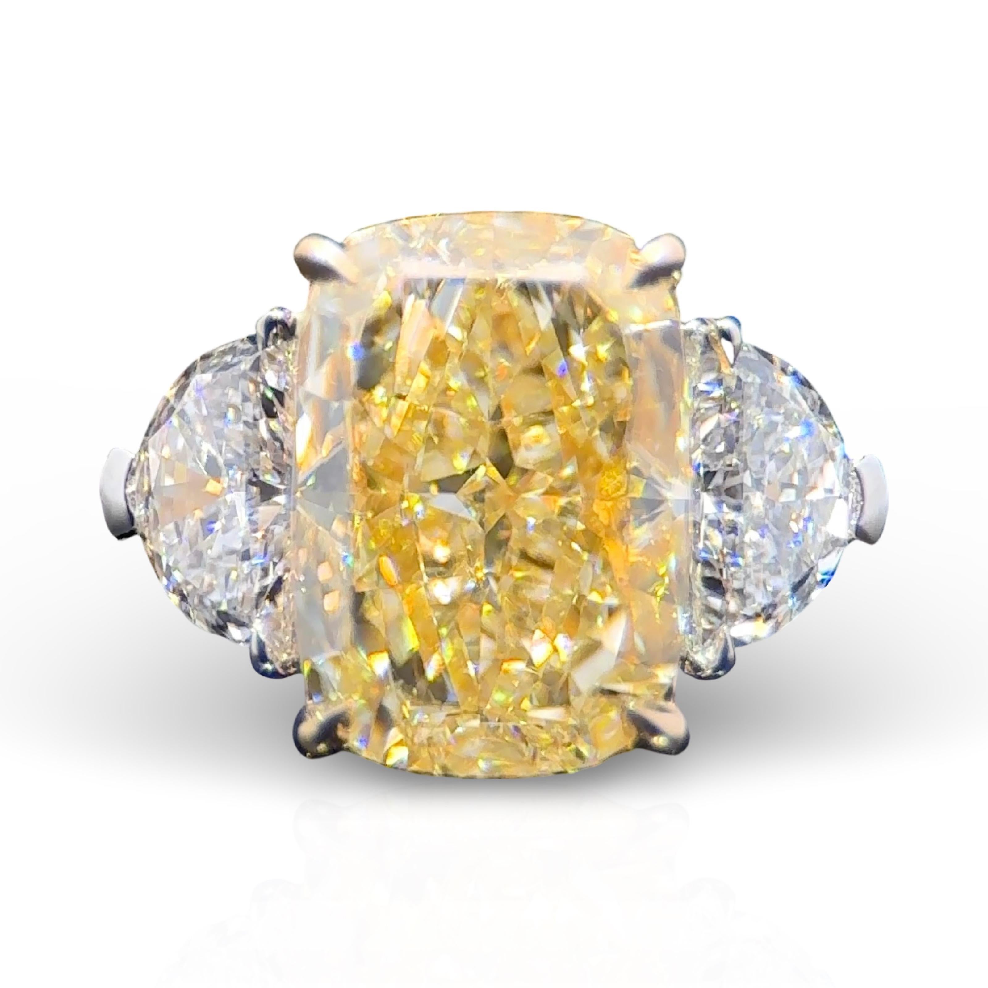 An beautifully crafted, GIA Certified, 4.09 Carat Elongated Cushion Cut Yellow Diamond Three Stone Ring.
Featuring a soft cornered, pillow shaped Natural Yellow Cushion Cut Diamond with a 1.42 Ratio
Yellow Diamond Center Stone GIA Specs: 4.09 Carat