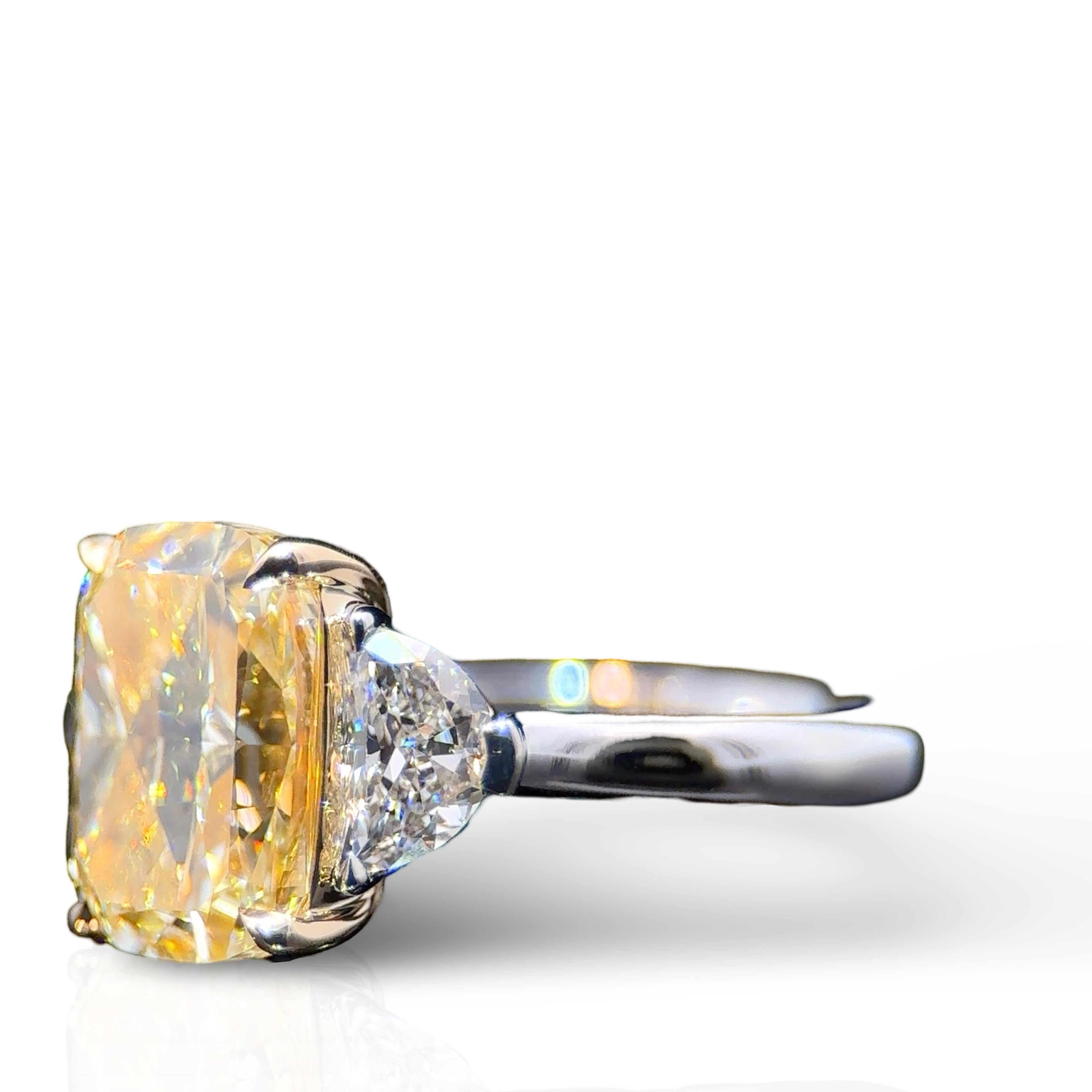 GIA Certified 4.09 Carat Elongated Cushion Cut Yellow Diamond Three Stone Ring In New Condition For Sale In New York, NY