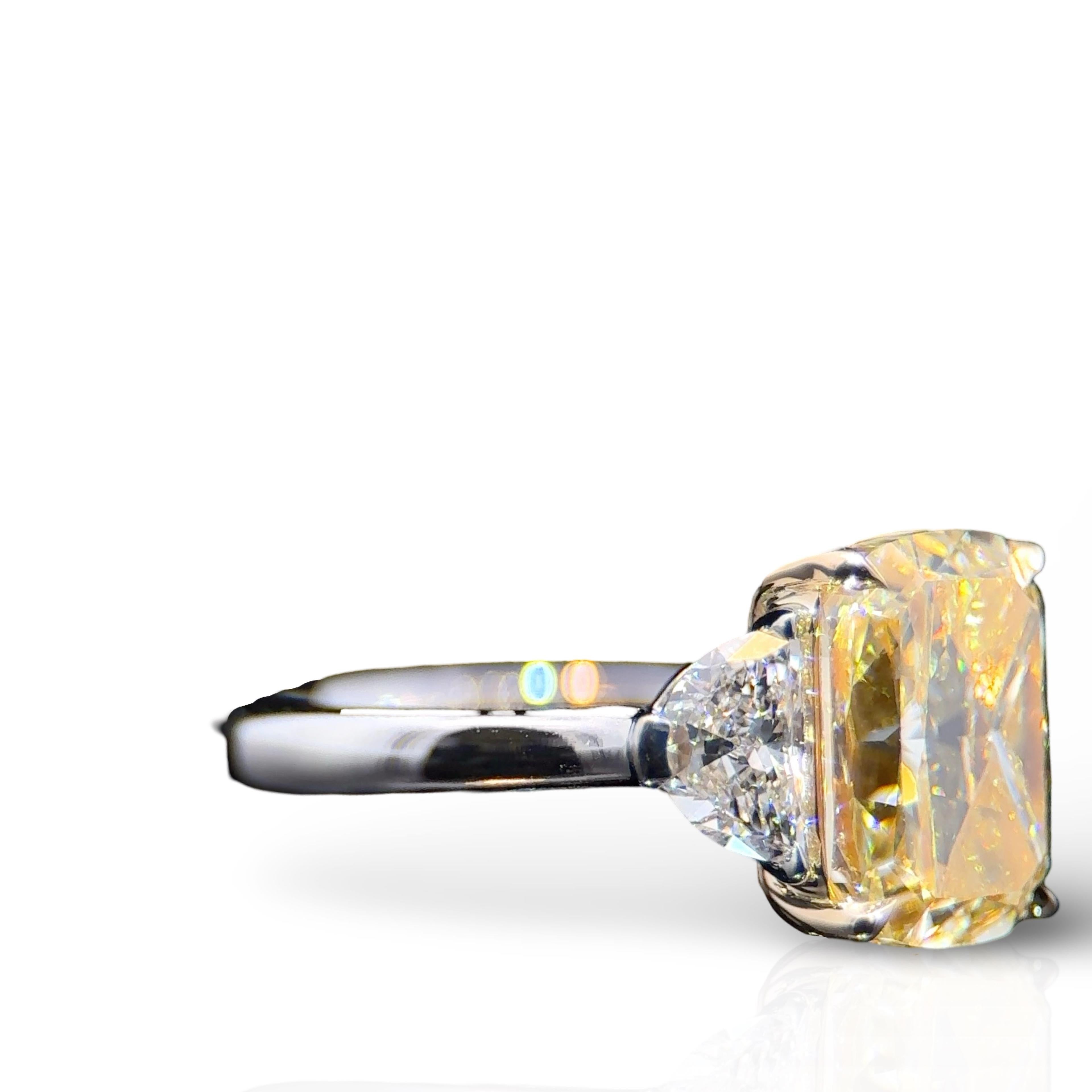 Women's or Men's GIA Certified 4.09 Carat Elongated Cushion Cut Yellow Diamond Three Stone Ring For Sale