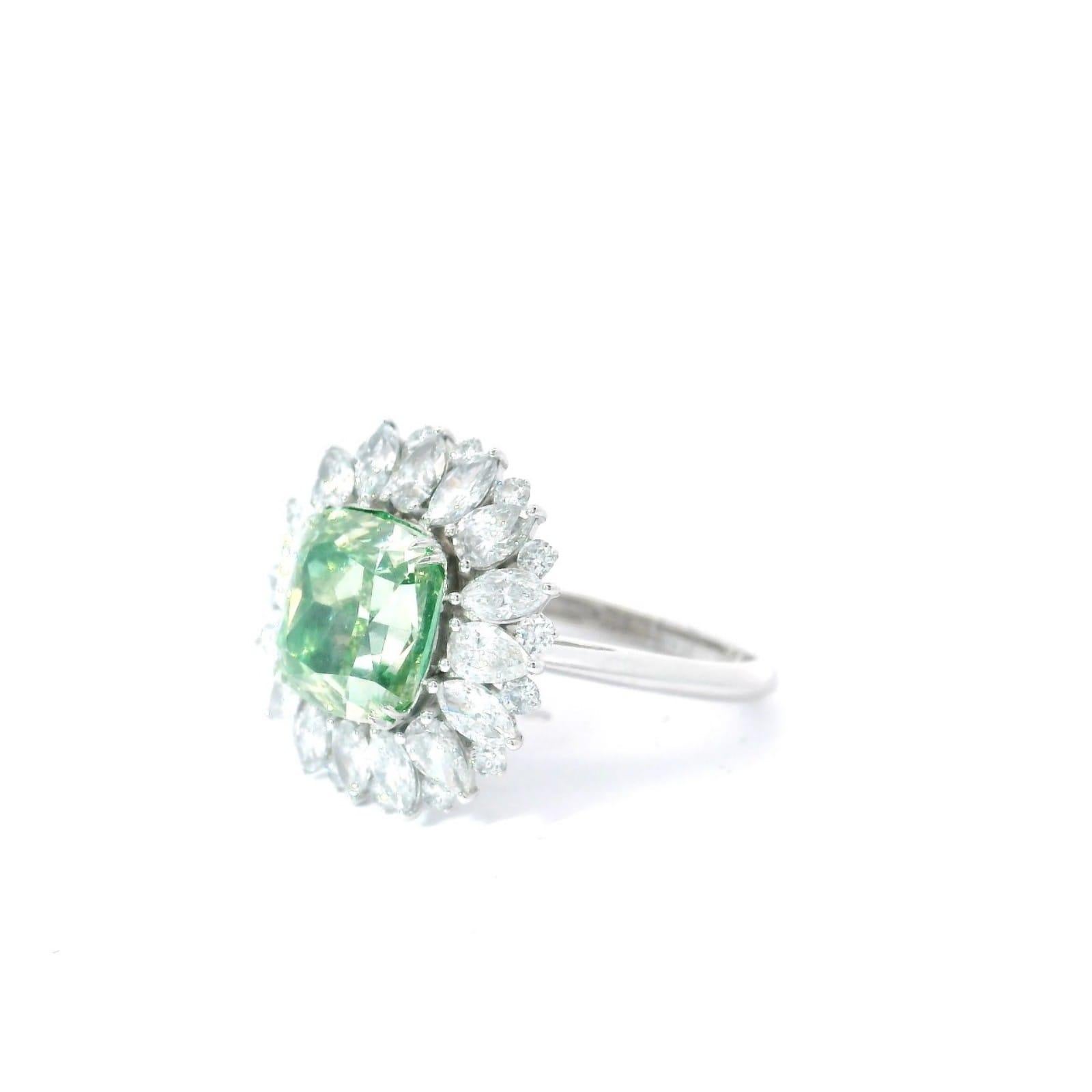 18kt white gold ring with diamonds
  
  Gold colour & karat: White gold 18kt
  Weight: 4.85 grams
  
  Set with-
  Stone type: Diamonds
  Shape: Cushion
  Carat: 4.09 ct
  Colour: Fancy Brownish Greenish Yellow
  Clarity: SI1
  
  Surrounding