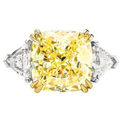 GIA Certified 4.10 Carat Fancy Light Yellow Cushion Three Stone Diamond Ring
