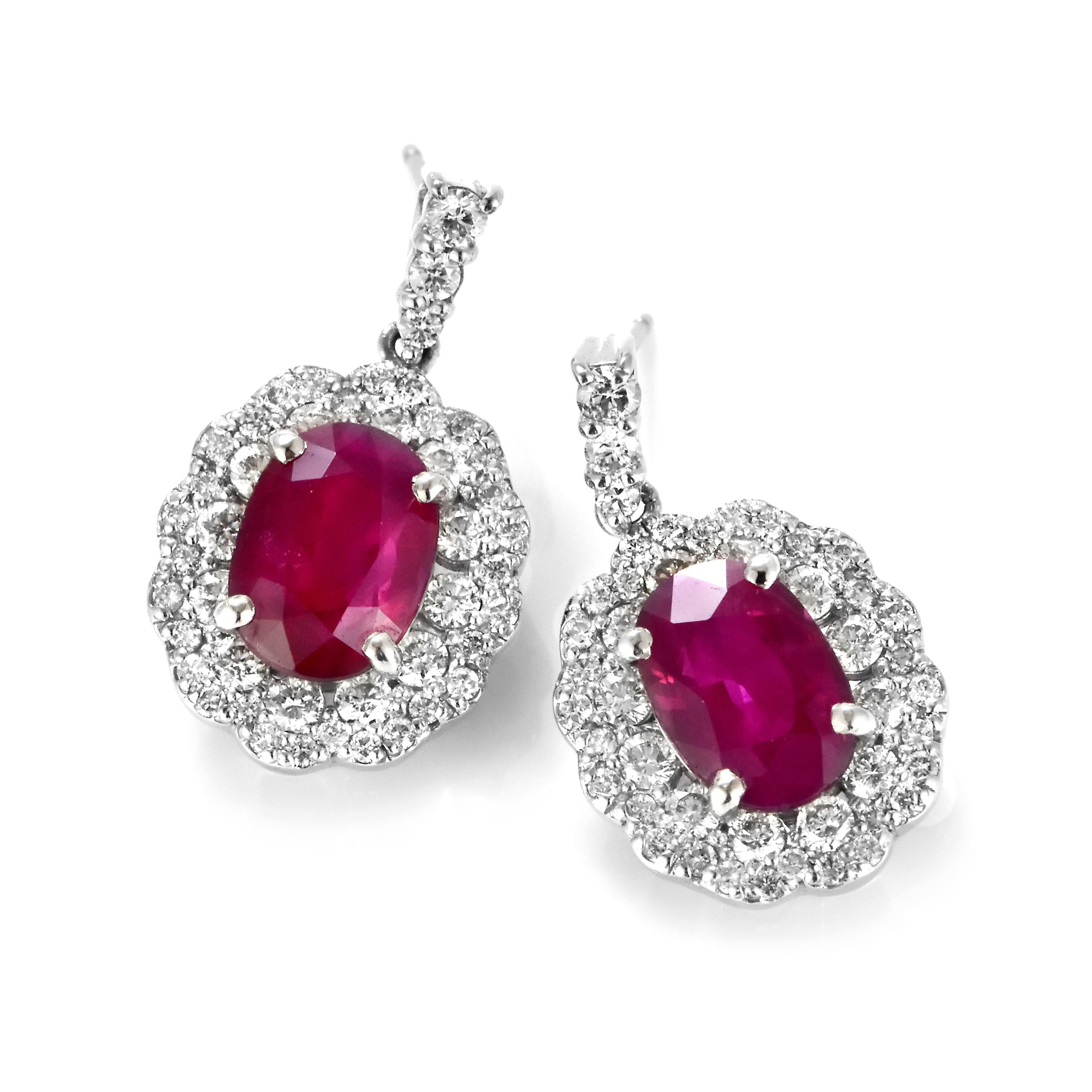 A gorgeous pair of Rubies weighing a total of 4.10 Carats , natural, Burmese rubies. The diamonds are a further 1.04 Carats. Rubies are referred to as 