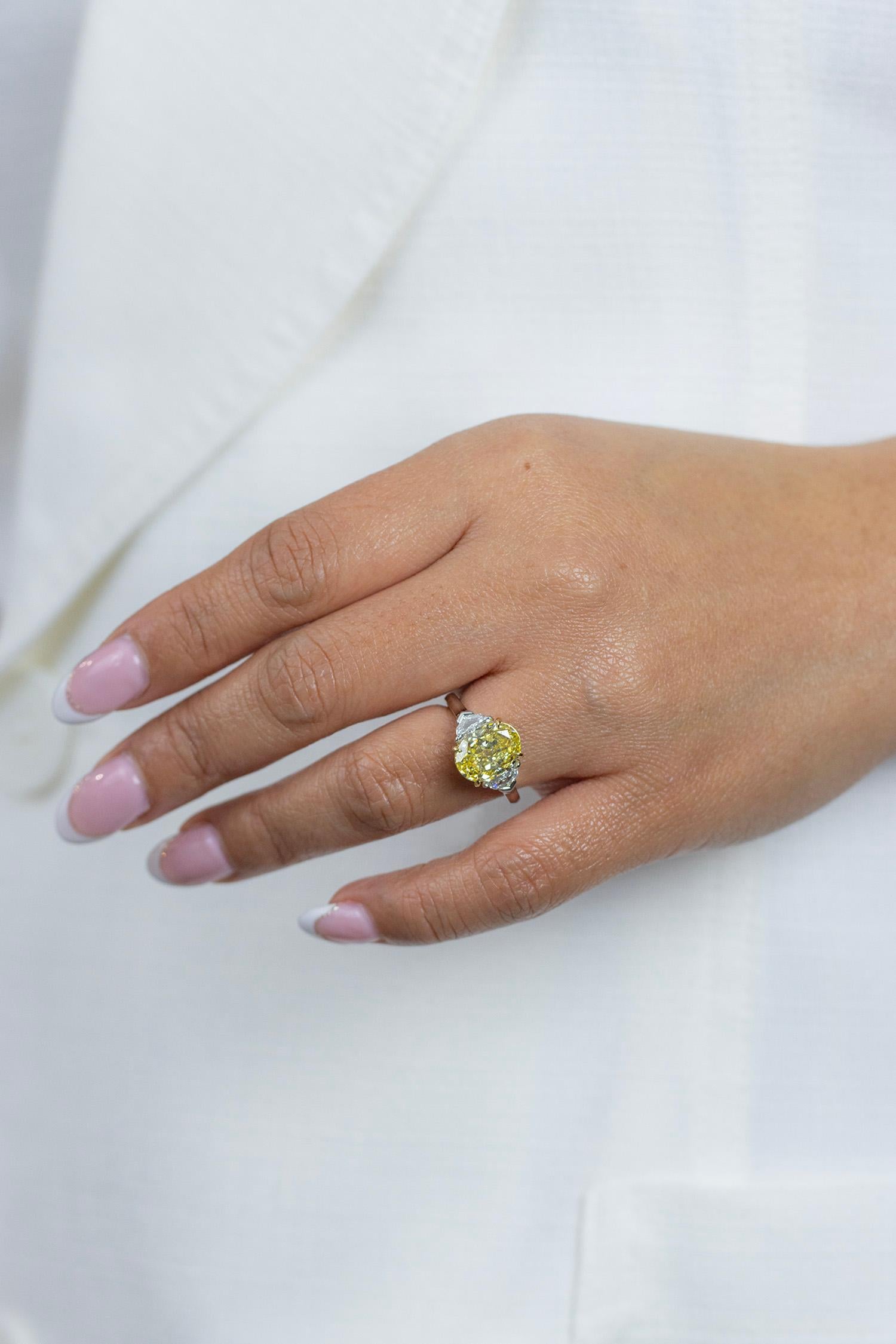 Women's GIA Certified 4.12 Carats Oval Cut Fancy Intense Yellow Diamond Ring For Sale