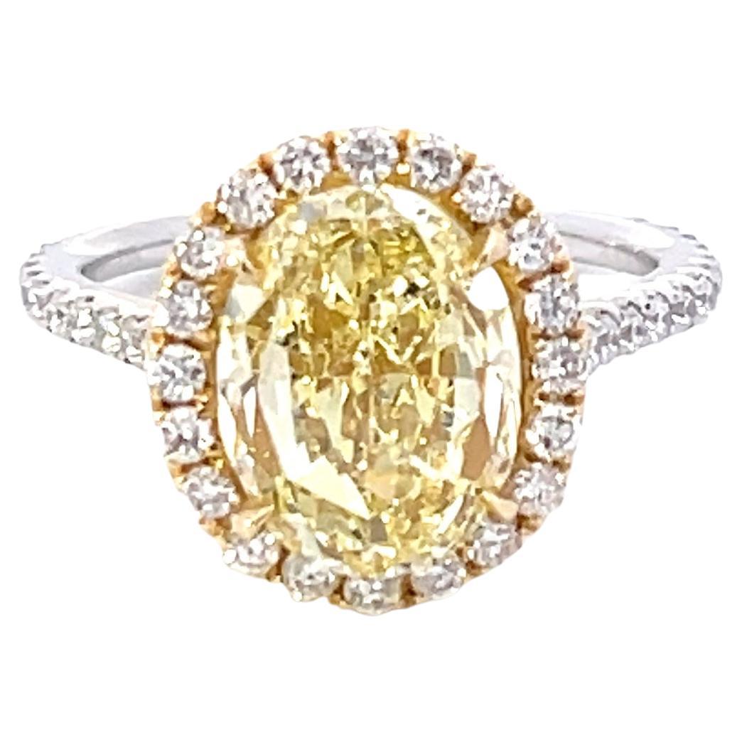 GIA Certified 4.13 Carat Fancy Yellow VS1 Oval Diamond Halo Engagement Ring For Sale