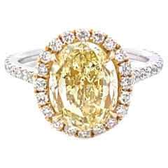 GIA Certified 4.13 Carat Fancy Yellow VS1 Oval Diamond Halo Engagement Ring
