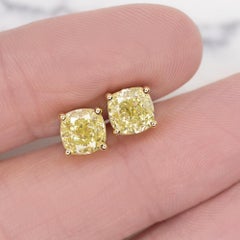 GIA Certified 4 Carat Fancy Yellow Cushion Cut Diamond Studs Set in 18 Carats