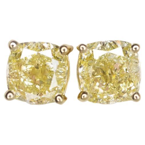 GIA Certified 4 Carat Fancy Yellow Cushion Cut Diamond Studs Set in 18 Carats For Sale