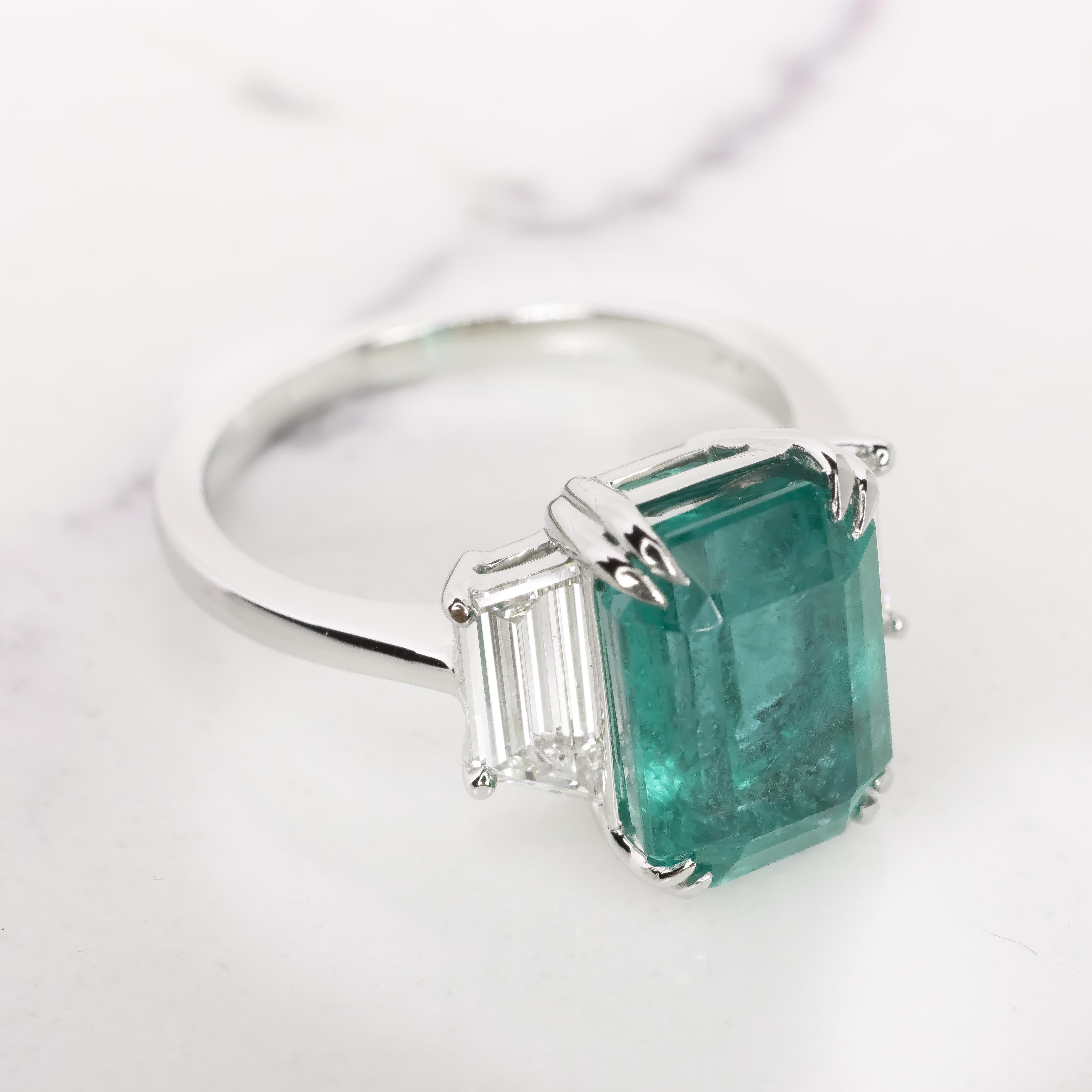 Discover the pinnacle of sophistication with our breathtaking 4.17ct Natural Emerald.

Certified by the prestigious Gemological Institute of America (GIA), rest assured of its impeccable quality and authenticity.

Prepare to be captivated by the
