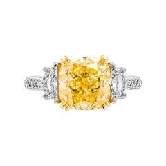 GIA Certified 4.17 Carat Fancy Light Yellow Cushion Cut Three-Stone Ring
