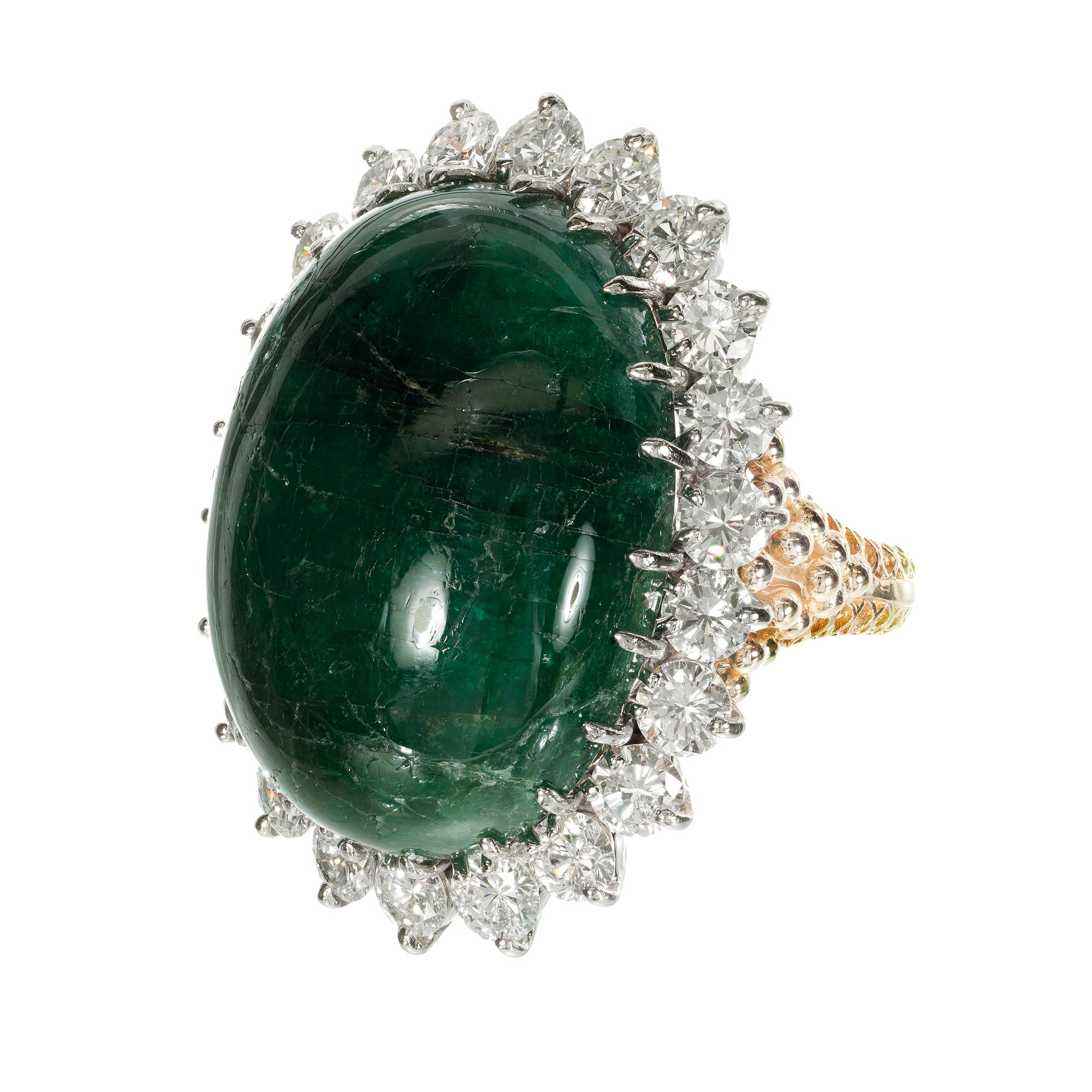 Large Oval natural cabochon emerald and diamond domed cocktail ring. 41.78 carat center oval emerald GIA certified. Set in 18k yellow gold with a halo of 5.50ct diamonds set in 18k white gold crown. GIA certified.  

1 oval green cabochon I emerald,