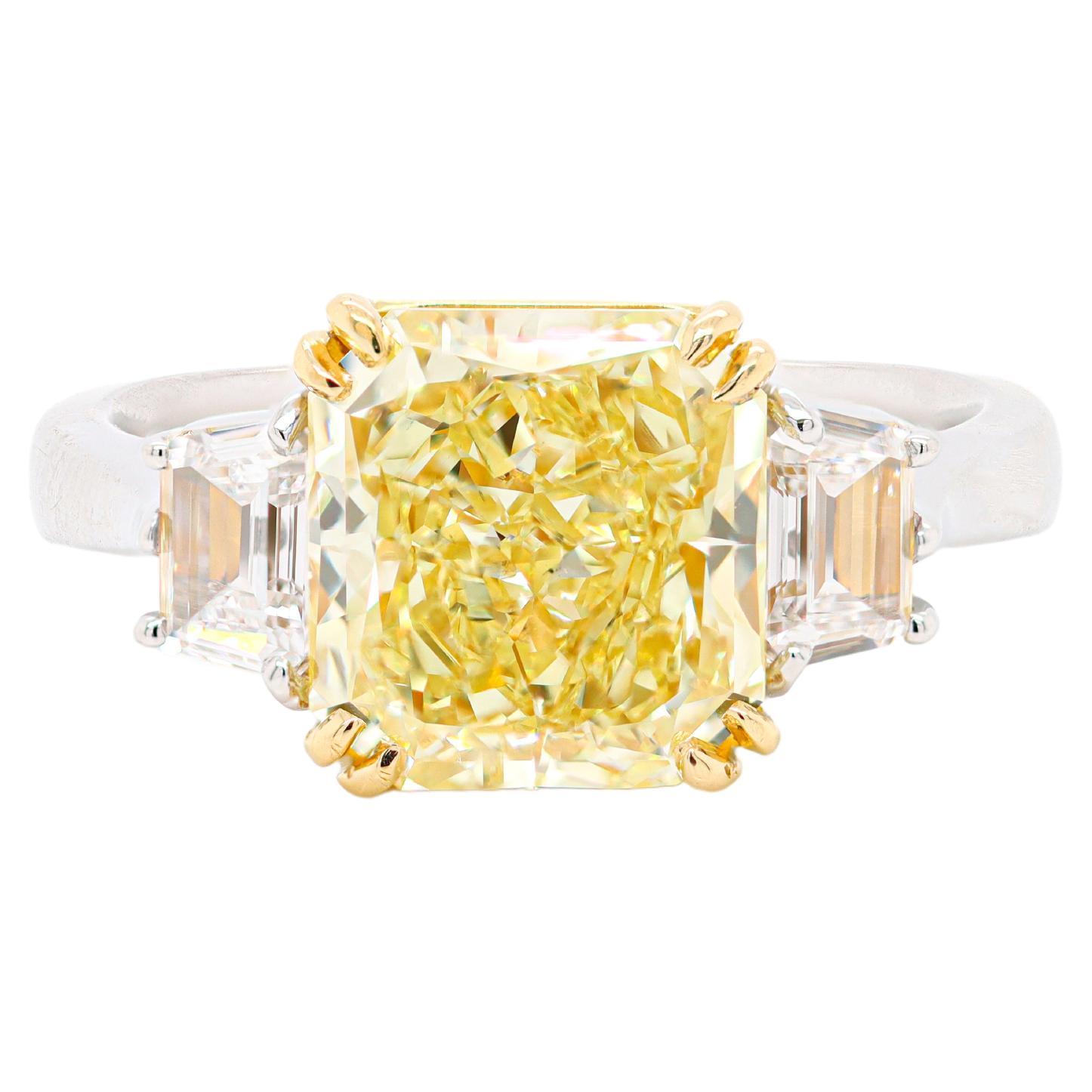 GIA Certified 4.20 Carat Fancy Intense Yellow Radiant Cut Three-Stone Ring For Sale