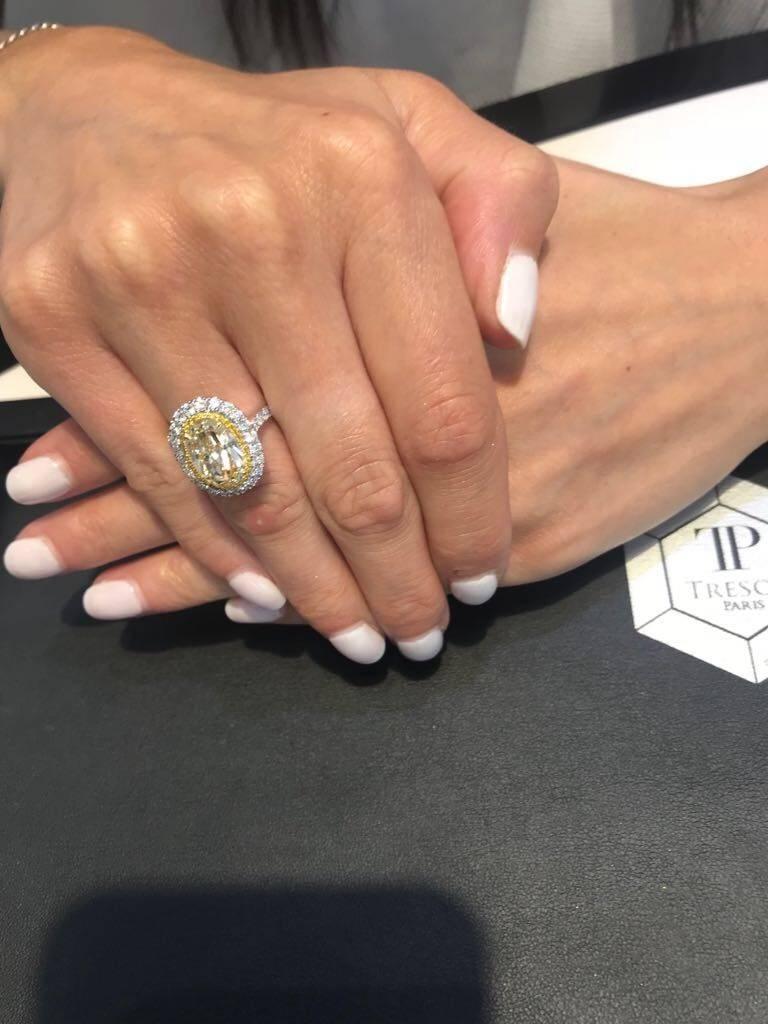 Modern 4.22 Carat Yellow White Diamond Oval Shape Halo Platinum GIA Engagement Ring For Sale