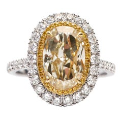 4.22 Carat Yellow White Diamond Oval Shape Halo Platinum GIA Engagement Ring