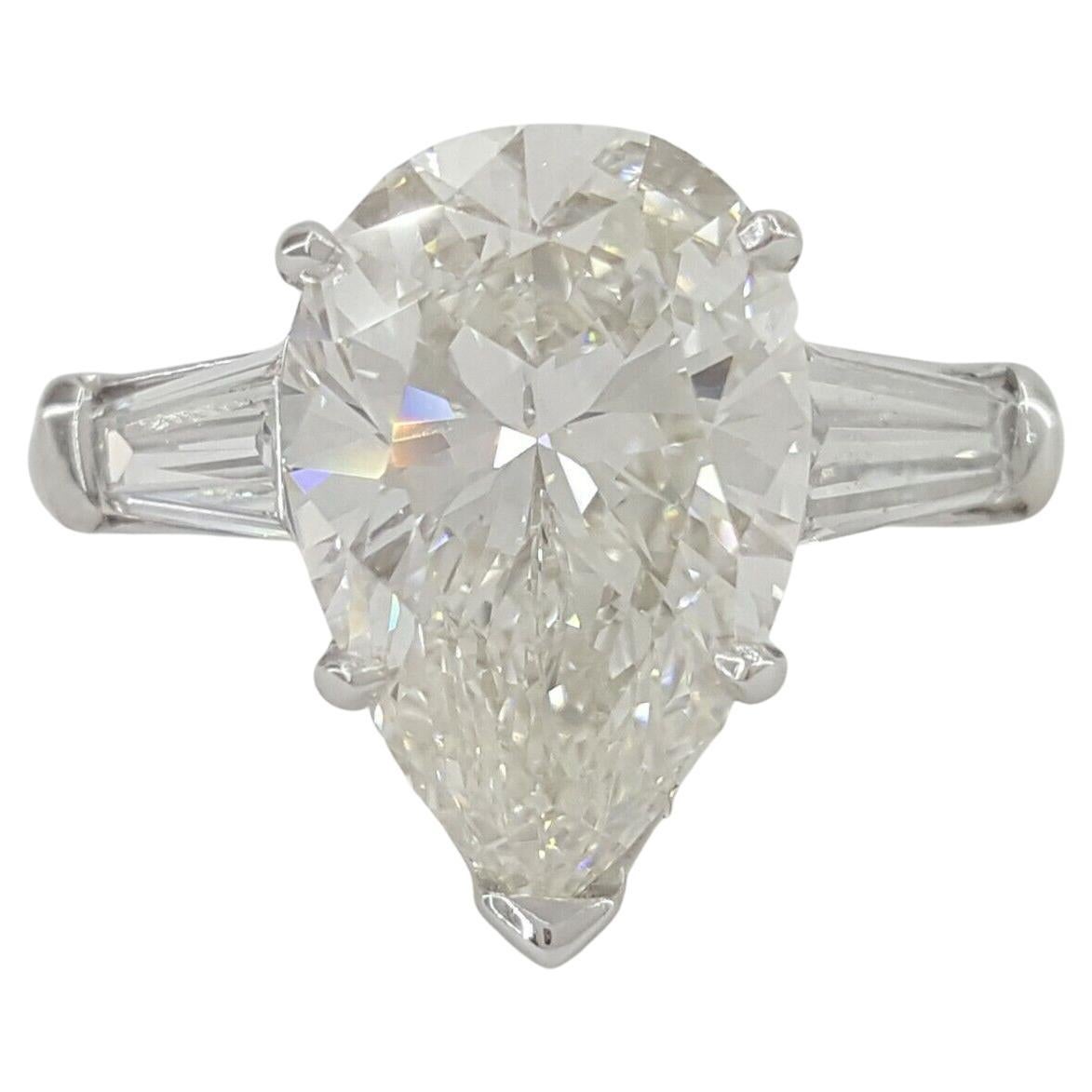 Modern GIA Certified 4.24 Carat Pear Cut Three Stone Diamond Ring For Sale