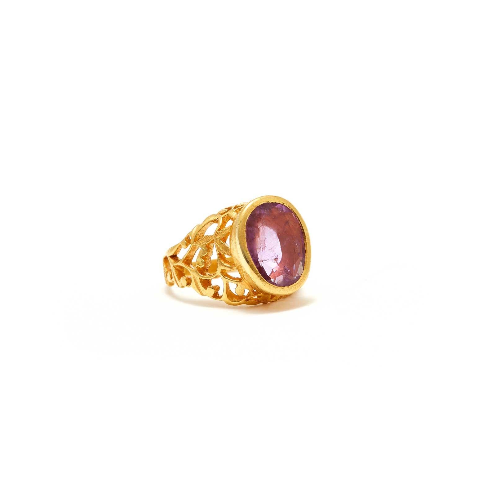 A Gia Certified 4.3 Karat Natural Ruby RIng.
Reflecting upon the luminous quality of this GIA certified 4.3 karat Sri Lankan ruby, one can see for a thousand years... this estate piece is magenta pink with purple undertones, natural and unheated, in
