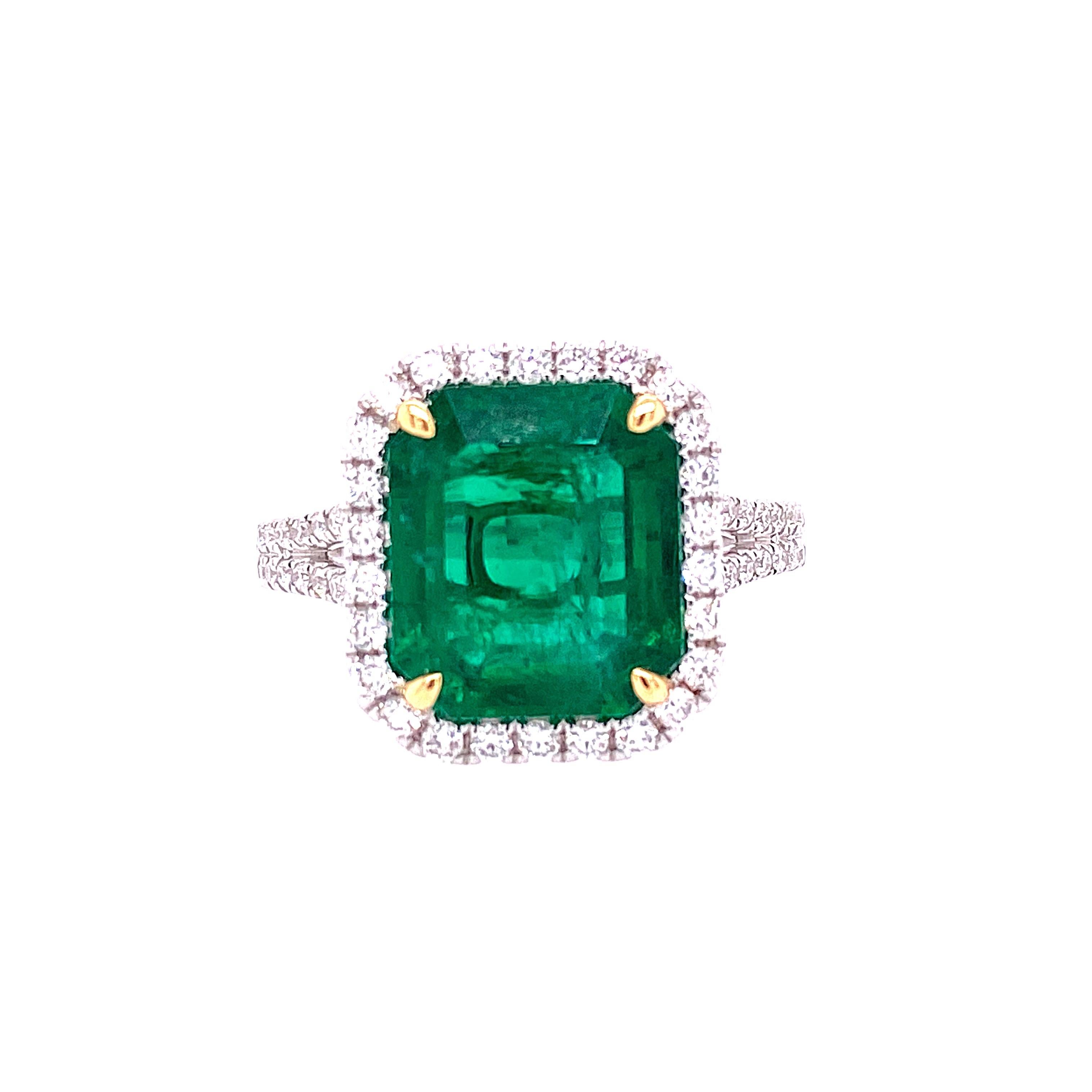 This stunning Cocktail Ring features a beautiful GIA Certified 4.30 Carat Emerald Cut African Emerald with a Diamond Halo, that sits on a Double Diamond Shank. This Ring is set in 18K White Gold, with 18K Yellow Gold prongs on the center stone.