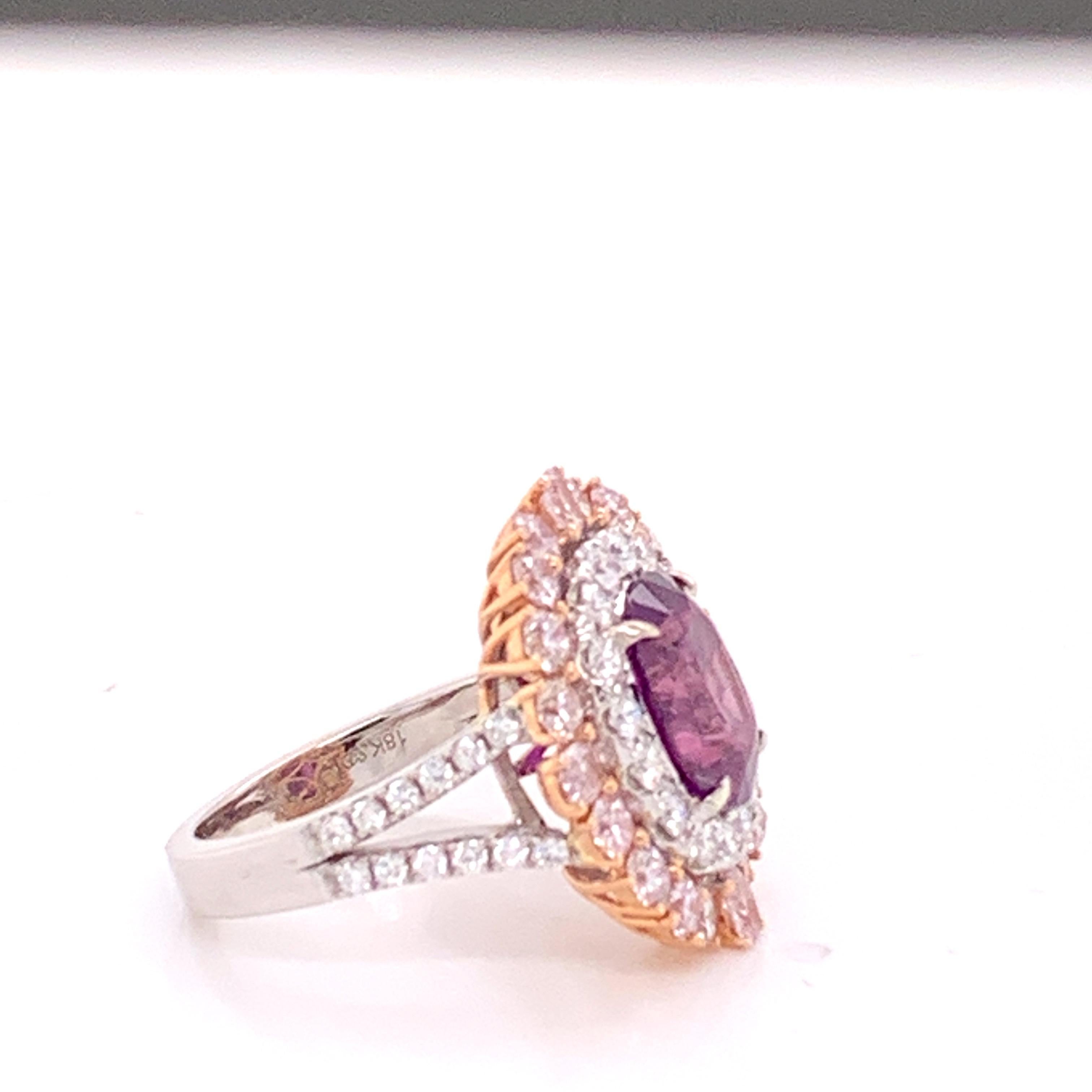 GIA Certified Natural Purple 4.30 carat oval  sapphire , Pink Diamond 1.64 carat and white Round Diamond set in 18 Karat two tone gold is one of a kind handcrafted custom designed Ring . 

The Ring is Sizable 7. If you would like to ask any question