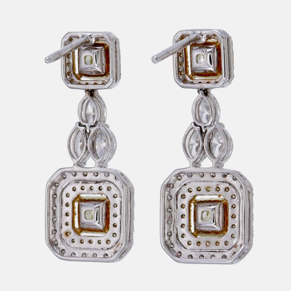 Moderno GIA Certified 4.31 Carat Fancy Intense Yellow Diamond Earrings In 18 Karat White in vendita