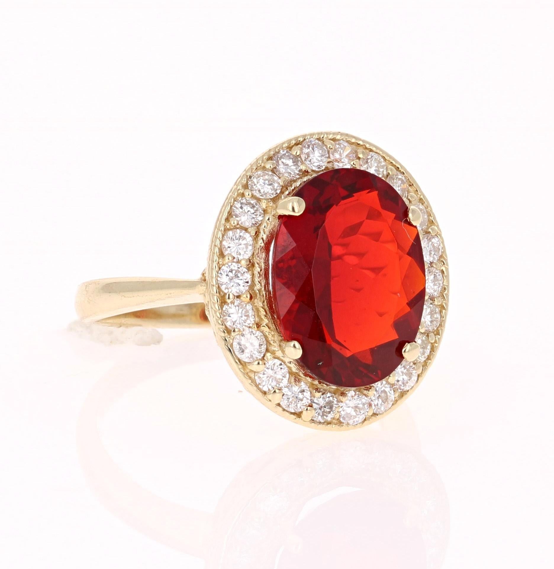 This gorgeous GIA Certified Cocktail ring has a beautiful Oval Cut Fire Opal that weighs 3.58 Carats and 22 Round Cut Diamonds that weigh 0.74 Carats. The Clarity and Color of the Diamonds are SI2-F.  The Total carat weight of the ring is 4.32