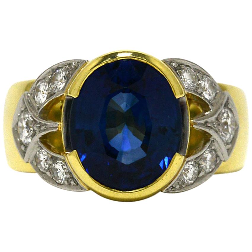 GIA Certified 4.39 Carat Vivid Blue Oval Sapphire Diamond Cocktail Ring