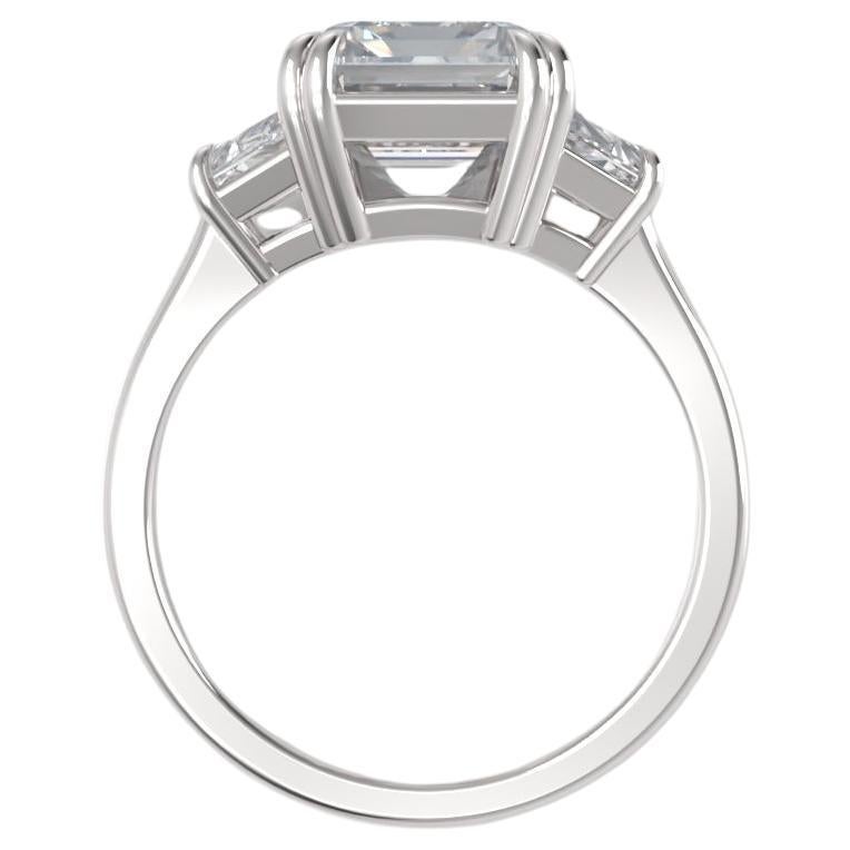 This striking ring showcases a GIA certified 4.01 carat emerald cut diamond, elegantly set in platinum.
Exuding timeless luxury and exceptional craftsmanship, it is perfect for those seeking a refined yet bold design.

The centerpiece, with an E